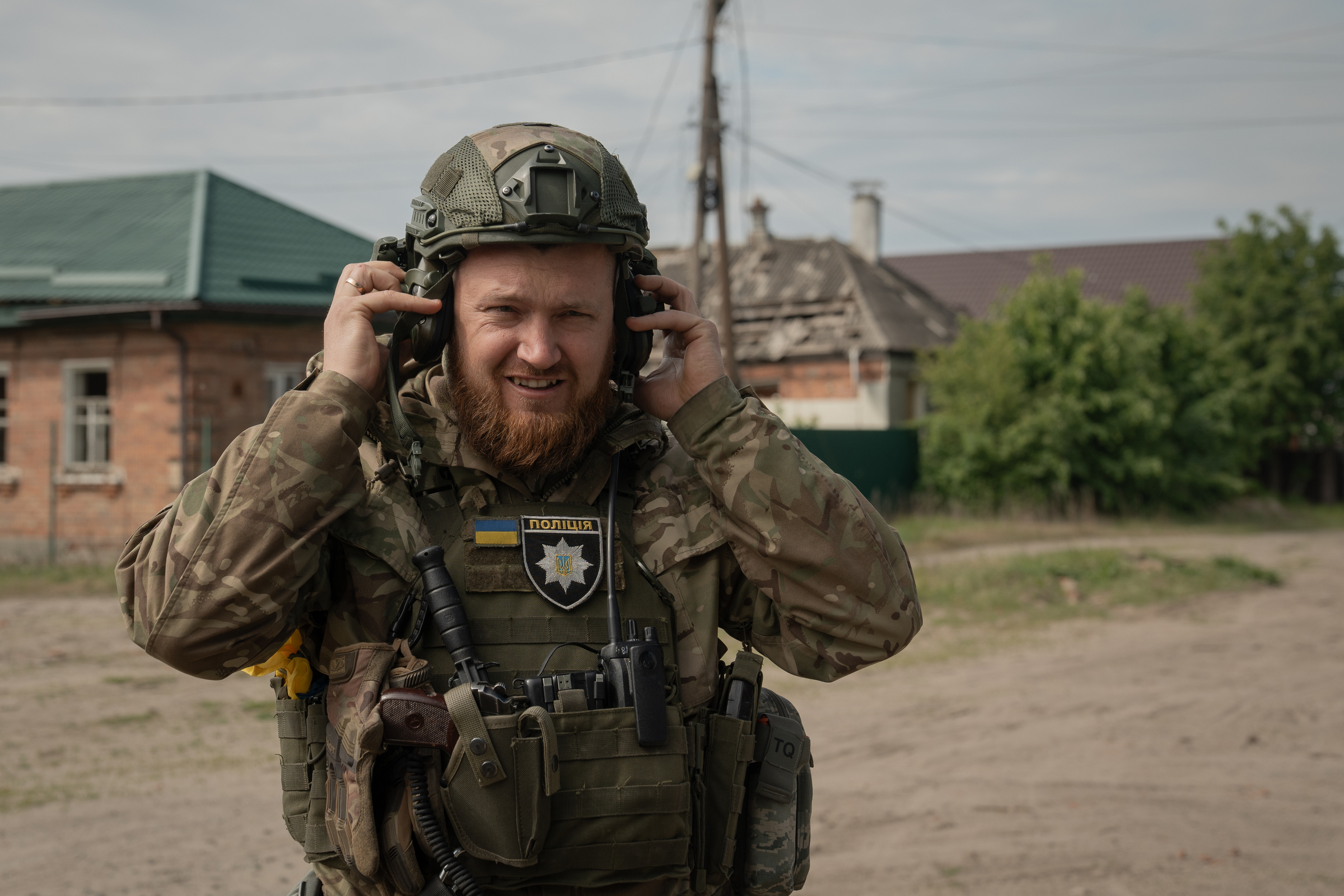 Oleksii Kharkivskyi, the head of Vovchansk police, is listening for the possible incoming glide bombs with his active headset. May 11, 2024 / Photo: Sliemzina Yana for Gwara Media
