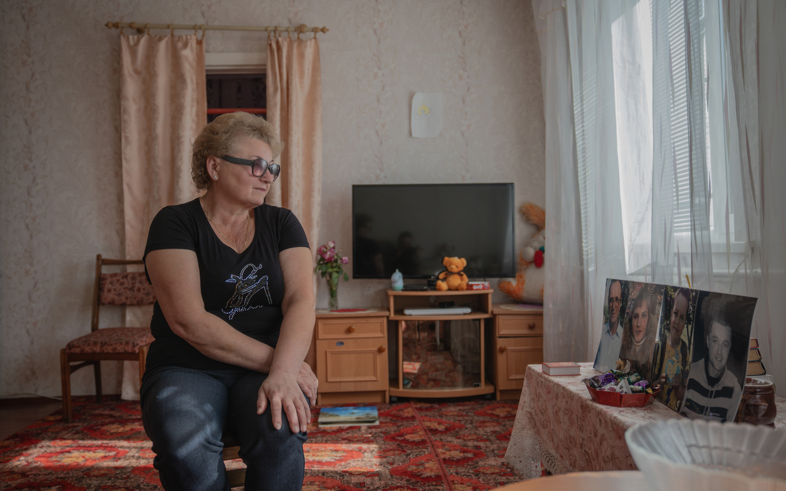 Valentina, a resident of Hroza, lost her entire family on October 5, 2023. She's at her home, a year after the tragedy. October 5, 2024 / Photo: Ivan Samoilov, Gwara Media