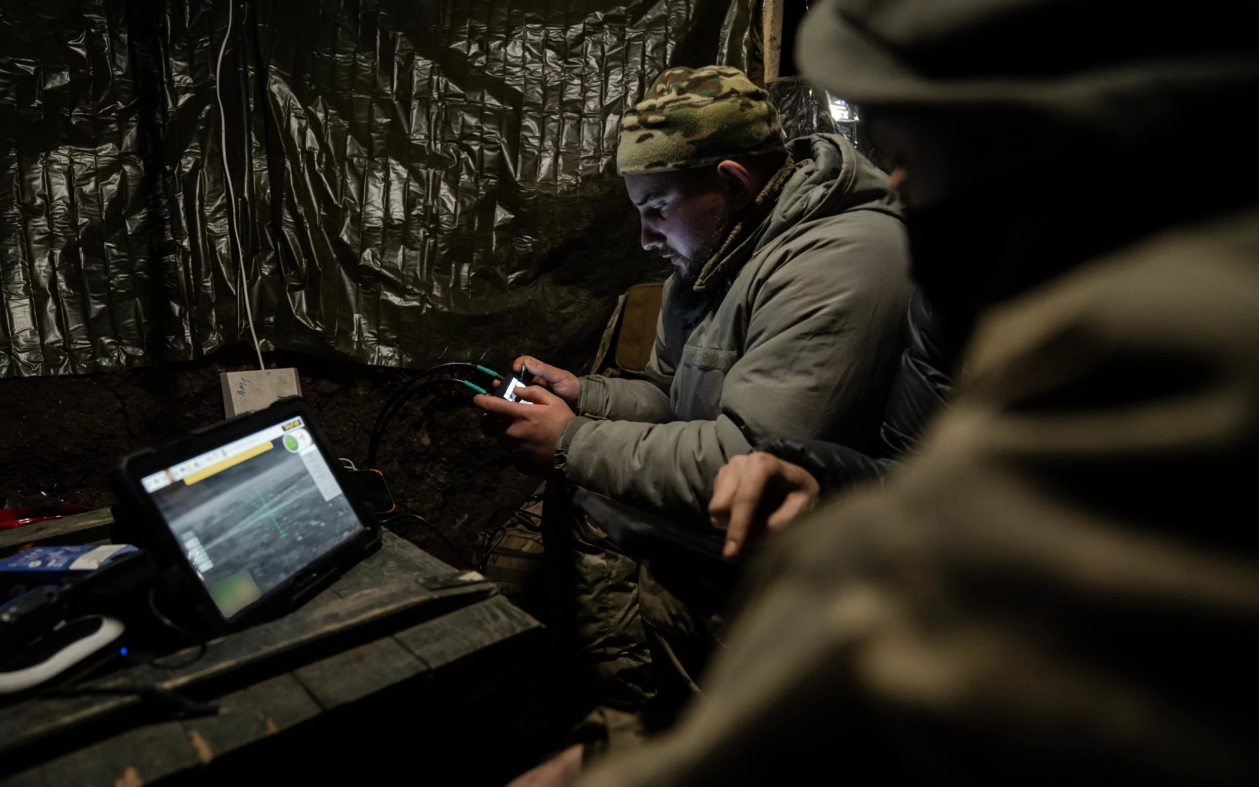 Soldiers of the Achilles Brigade in a dugout flying a drone towards Russian positions / Photo: Denys Klymenko, Gwara Media