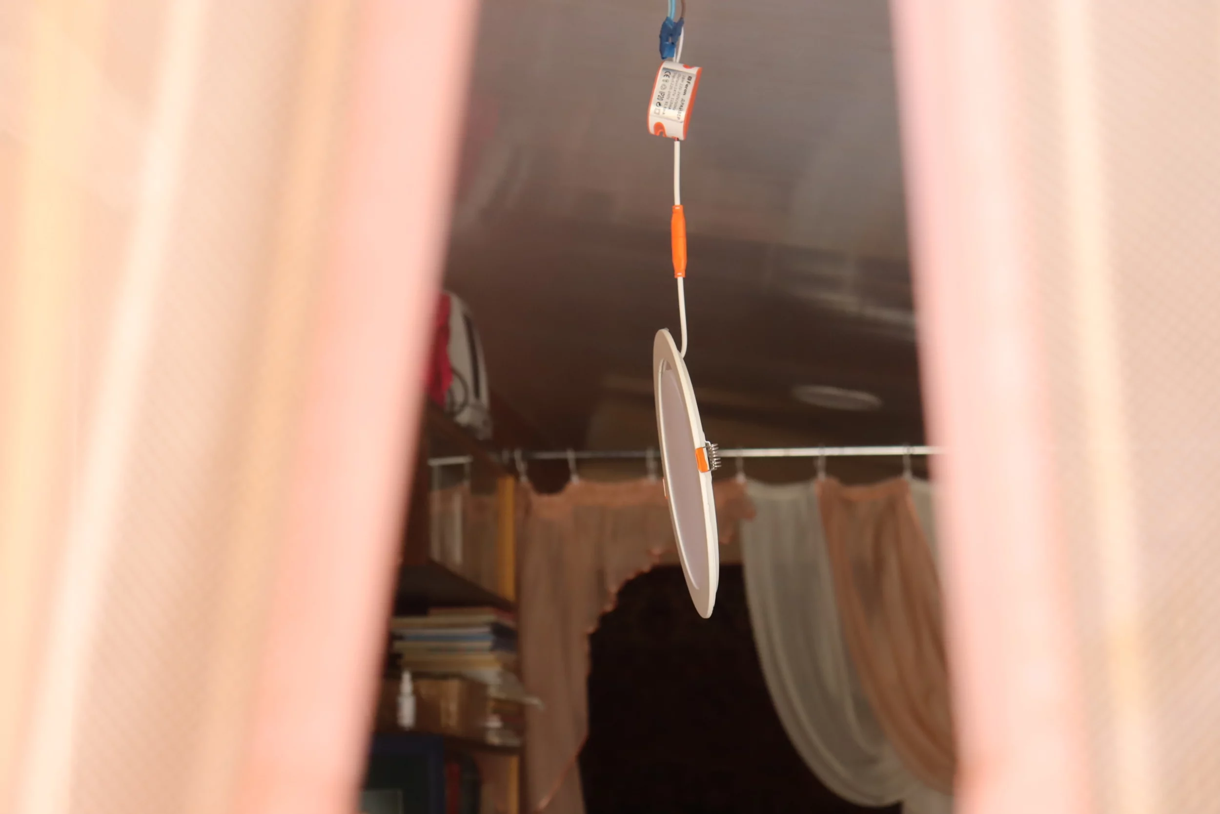 A lamp that's dropped from the ceiling in Oleksandr's house in Kulynychi, a village Russia attacked with a drone strike on May 21, 2024 / Photo: Yana Sliemzina for Gwara Media