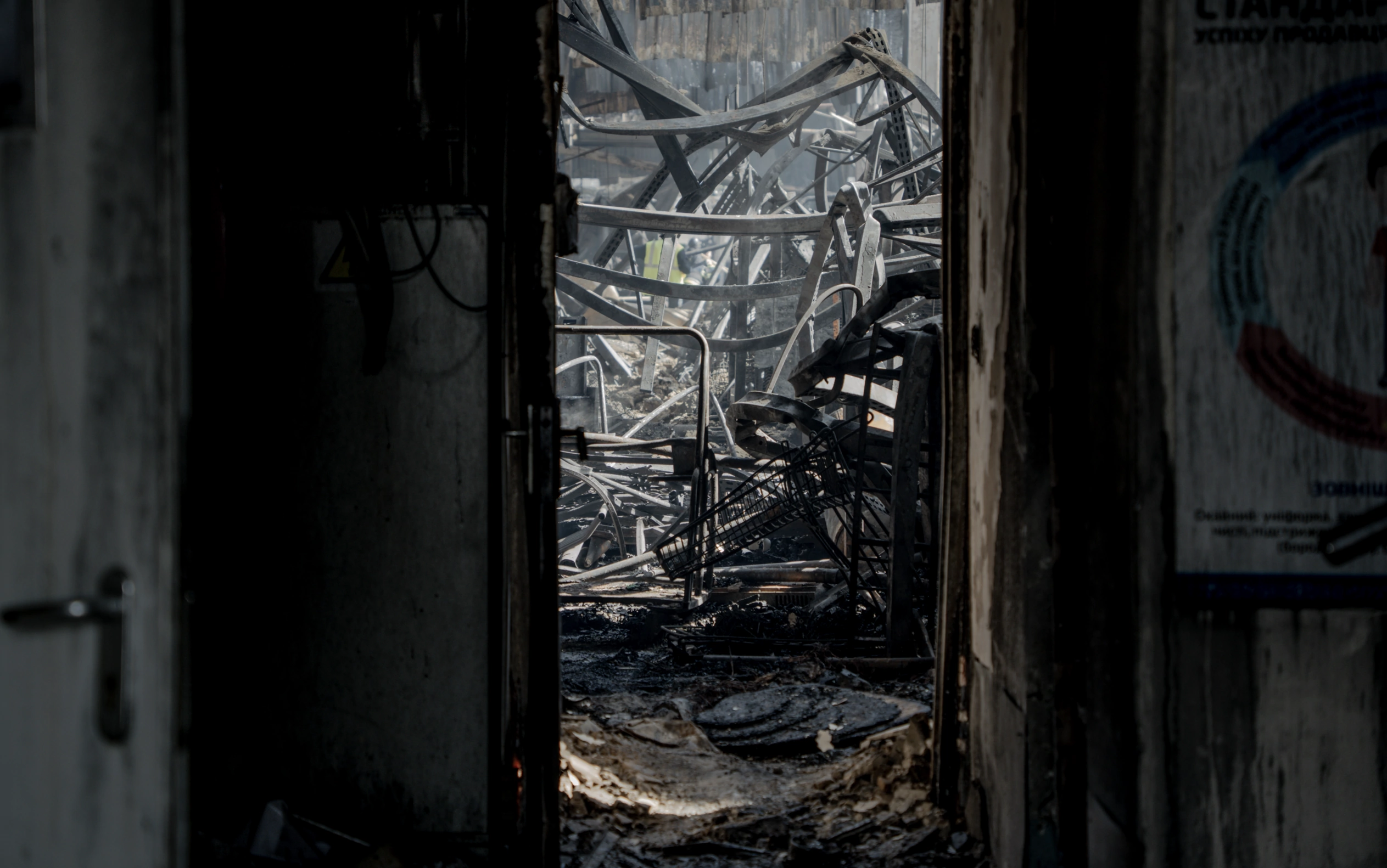 зображення до посту: In Photos: Aftermath of Russian attack on hypermarket in Kharkiv, which killed 18, including 12 and 17-year-old, injured 48  