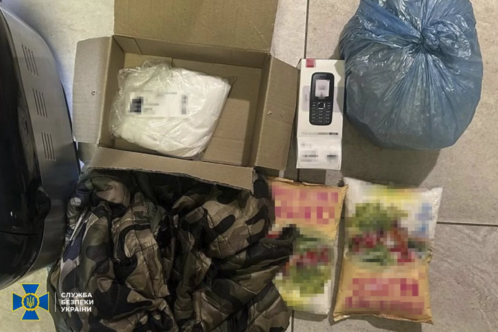 Обшук підозрюваної в отруєнні військового та підготовці теракту в Харкові