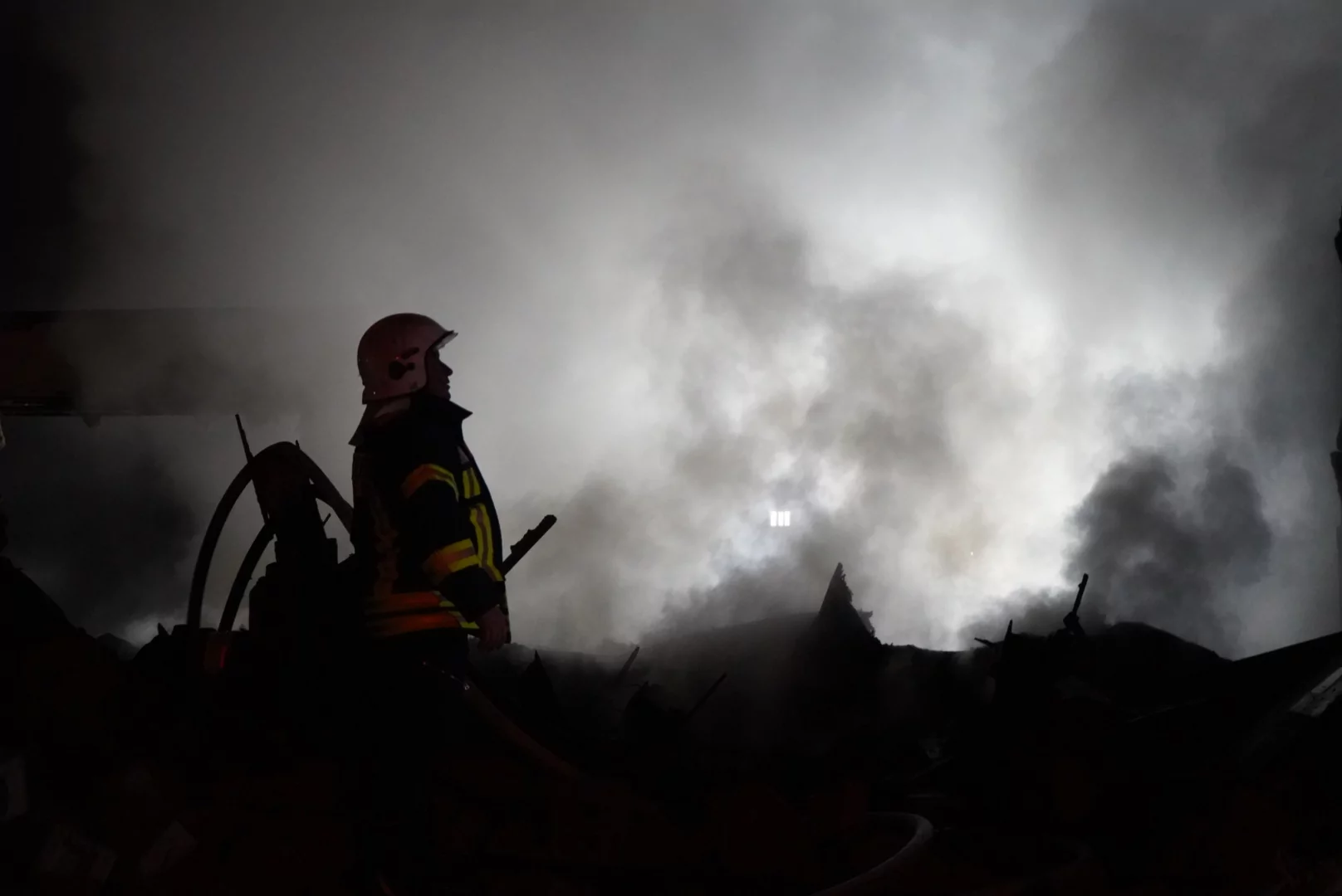 Kharkiv emergency workers putting out a fire in the aftermath of Russian drone attack on the city on March 26
