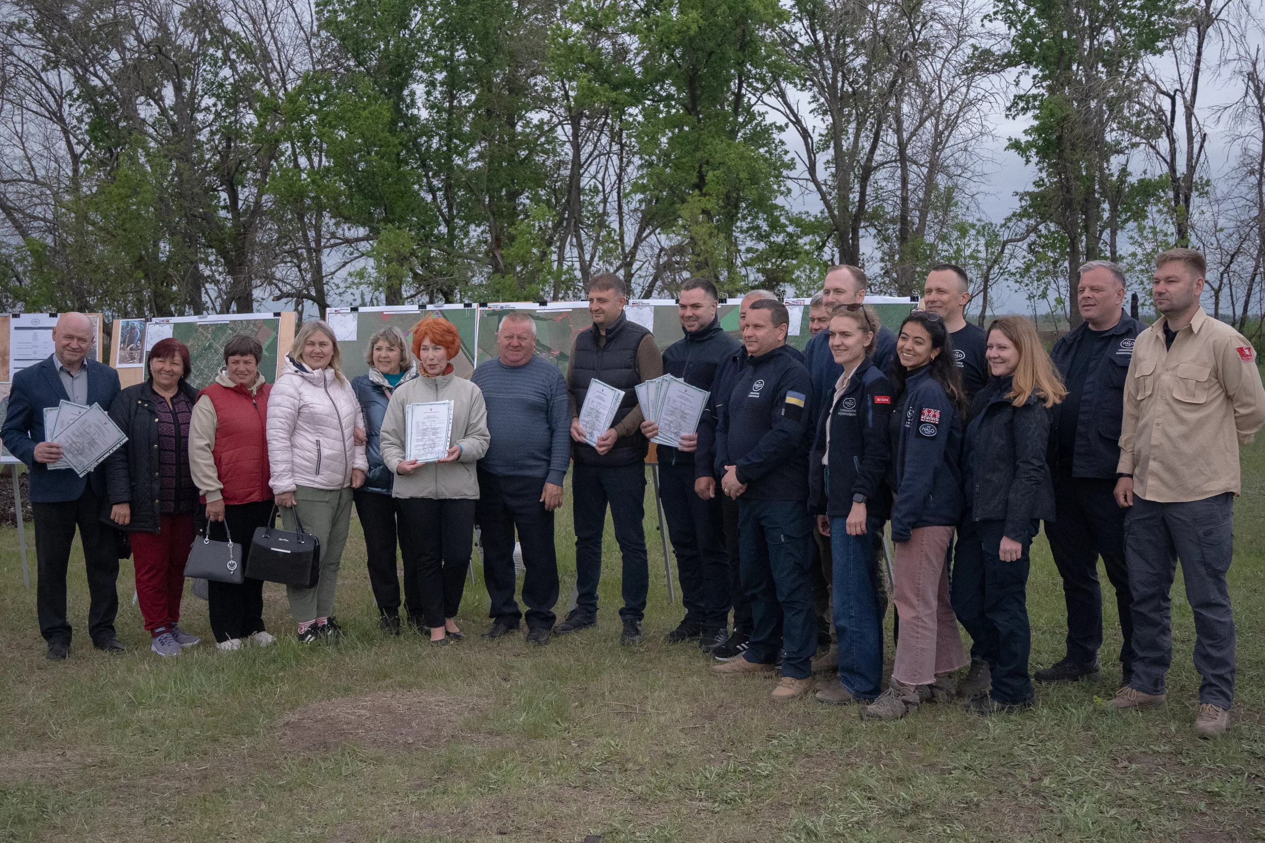 Chuhuiv district locals and representatives of “HALO Trust” at passing over demined agricultural land to communities in Kharkiv region, May 6