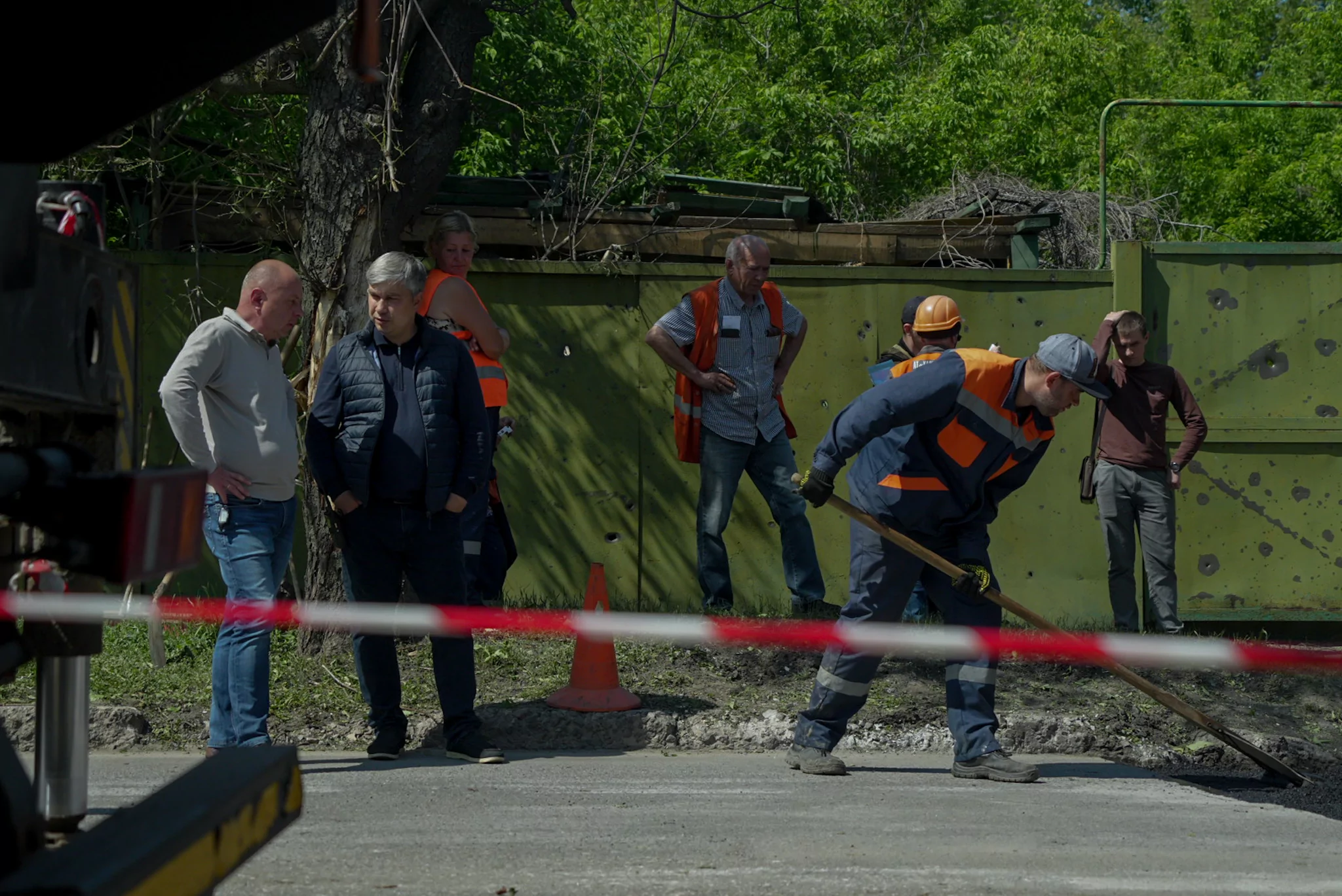 Specialists and municipal workers are working at the impact site after Russian attack on May 22