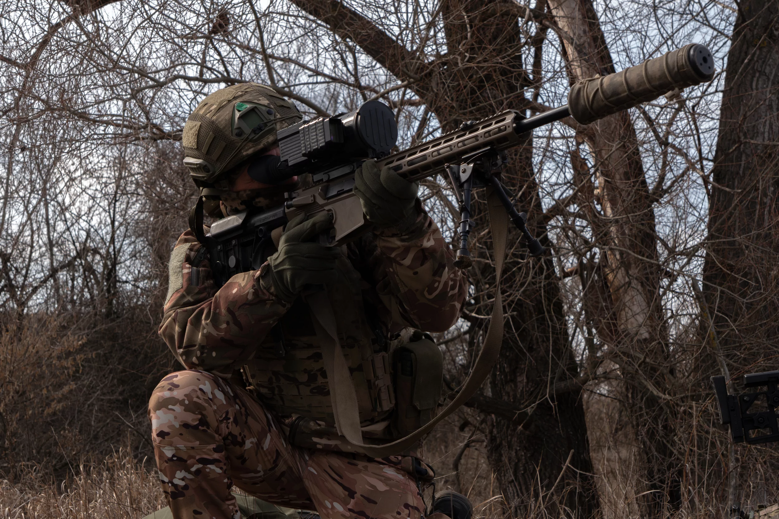 Sniper “Faust” demonstrates the kneeling shooting position
