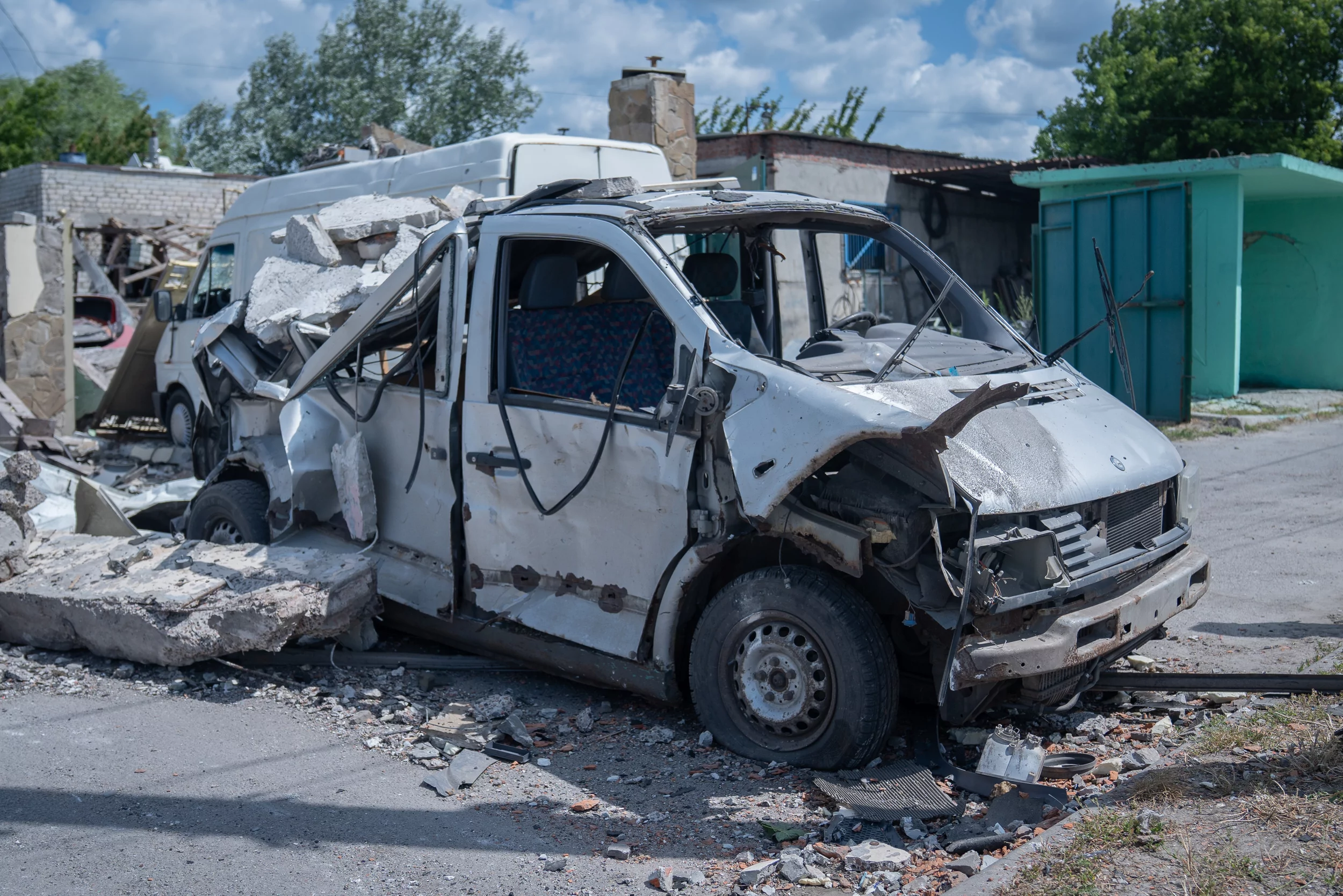 Damaged car at the service station after Russian drone attack in Pisochyn on June 30
