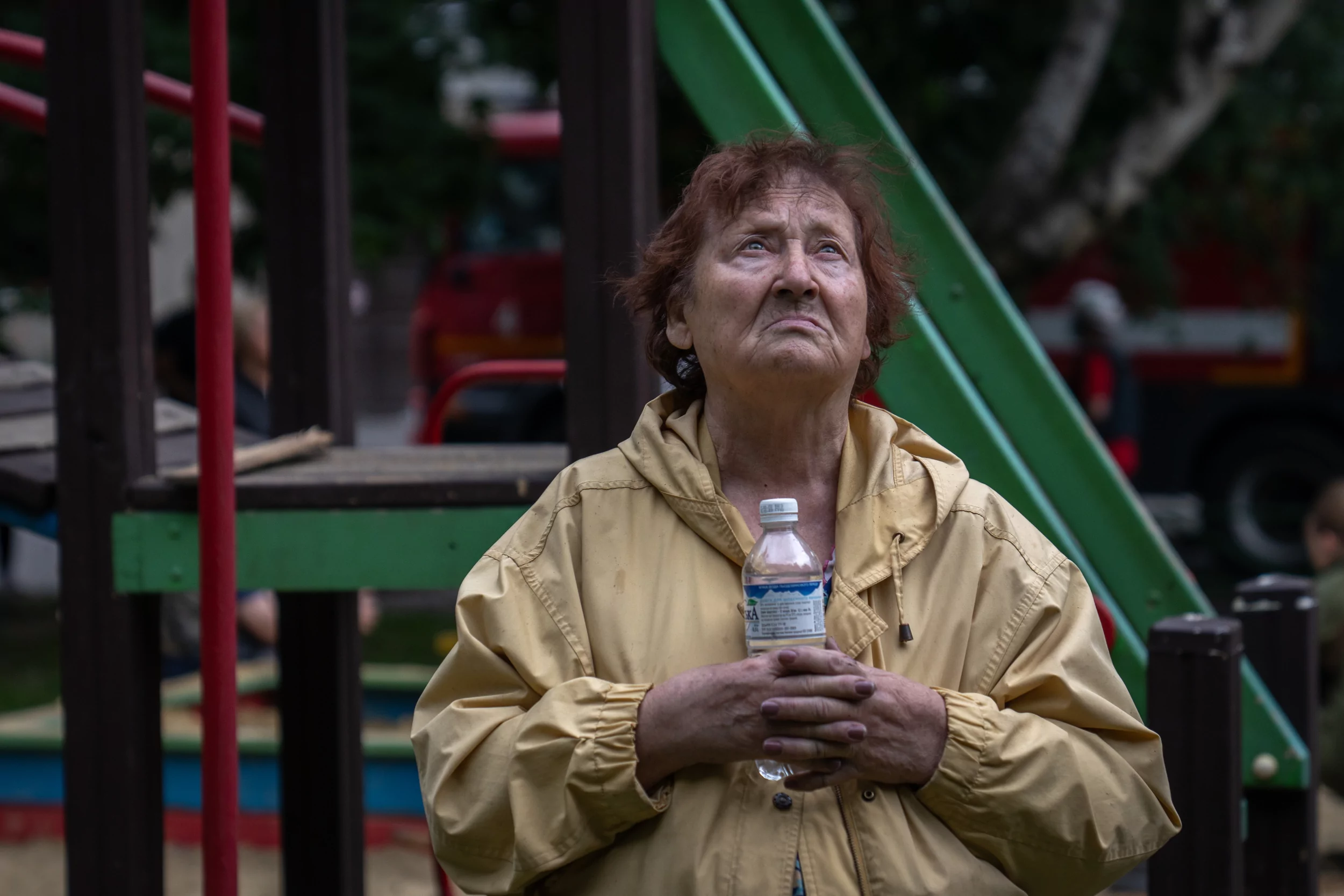 Resident of the Osnovianskyi district, hit by the Russian drone attack - woman with a bottle of water