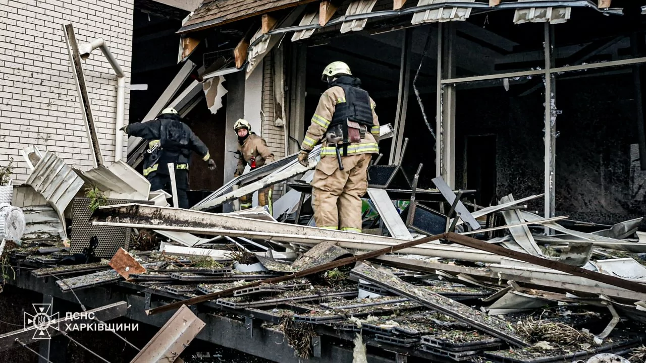 State Emergency Service workers clean the damage after Russian drone attack on Kharkiv on June 24