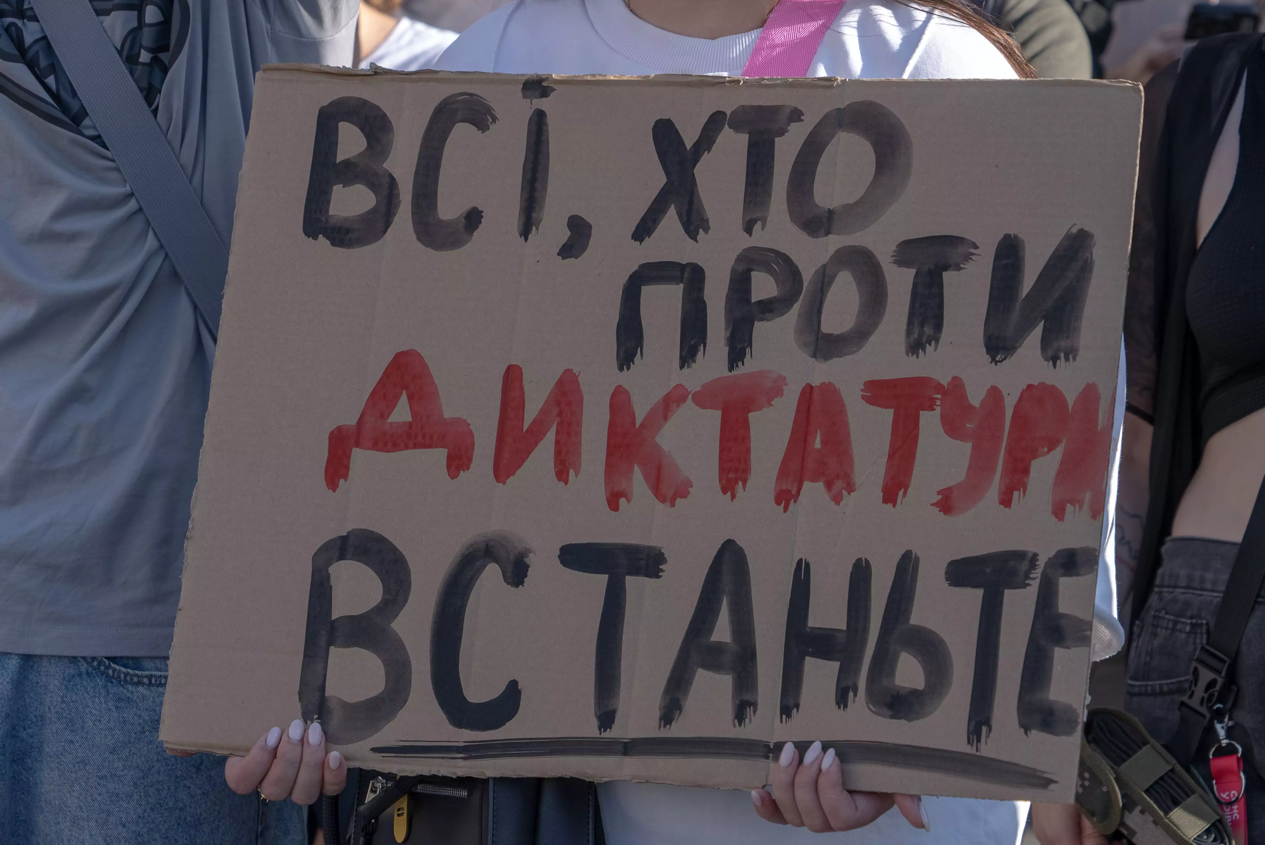 Protestor holds poster 