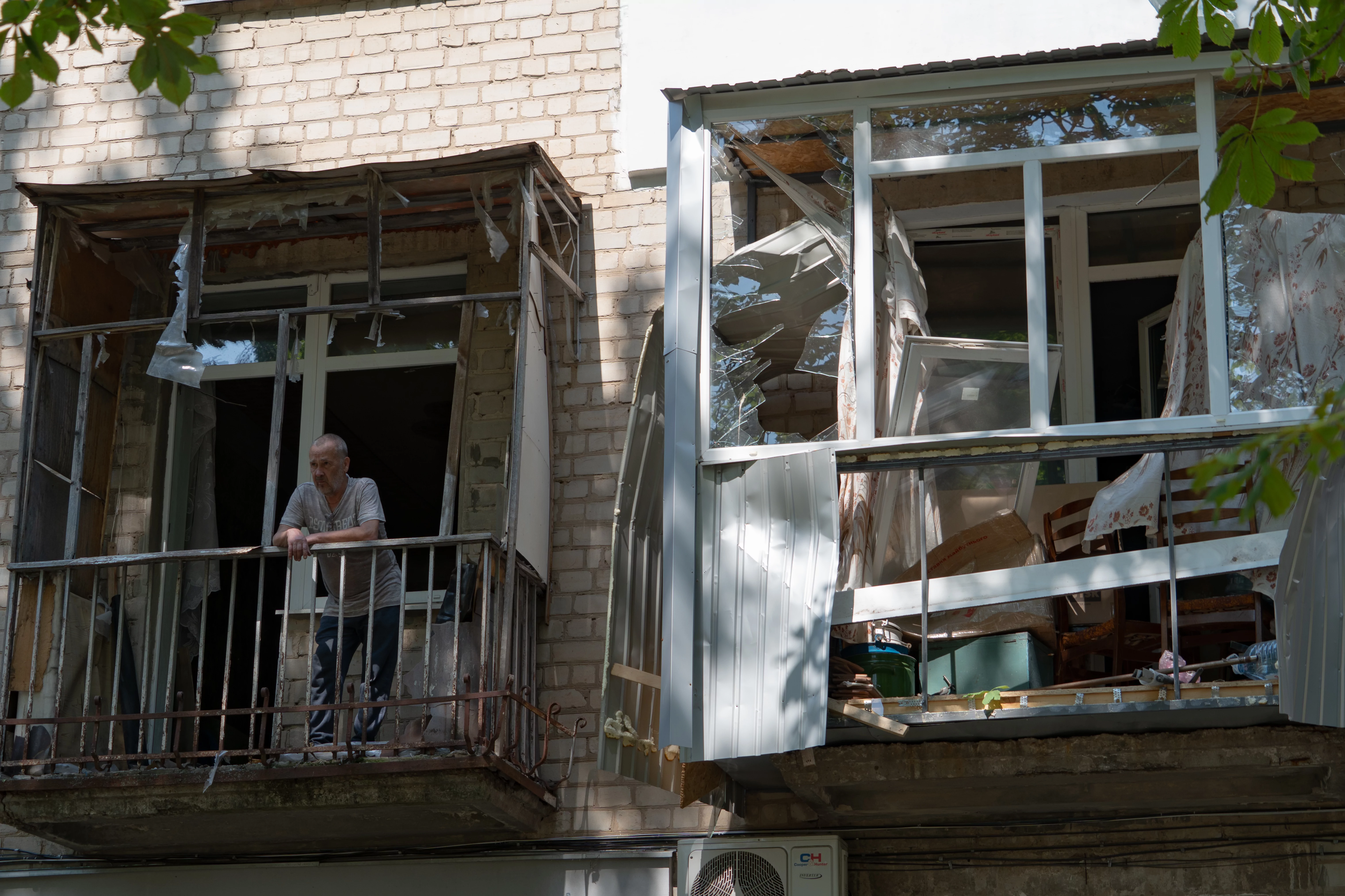 Man in the damaged apartment building in the aftermath of Russian drone attack on Shevchenkivskyi district of Kharkiv