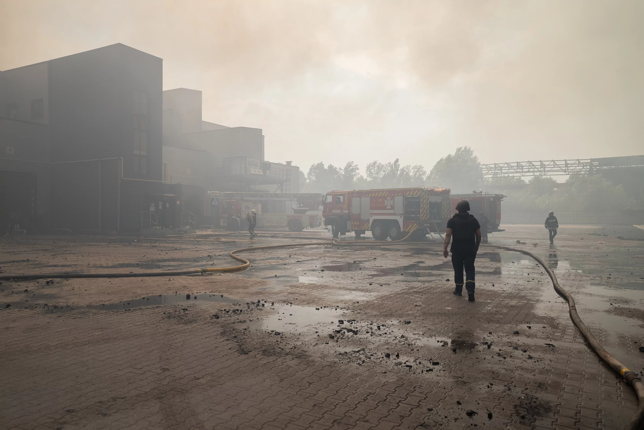 Firefighters extinguish the fire after Russian attack on Vasyshchevo village in Kharkiv outskirts on July 30
