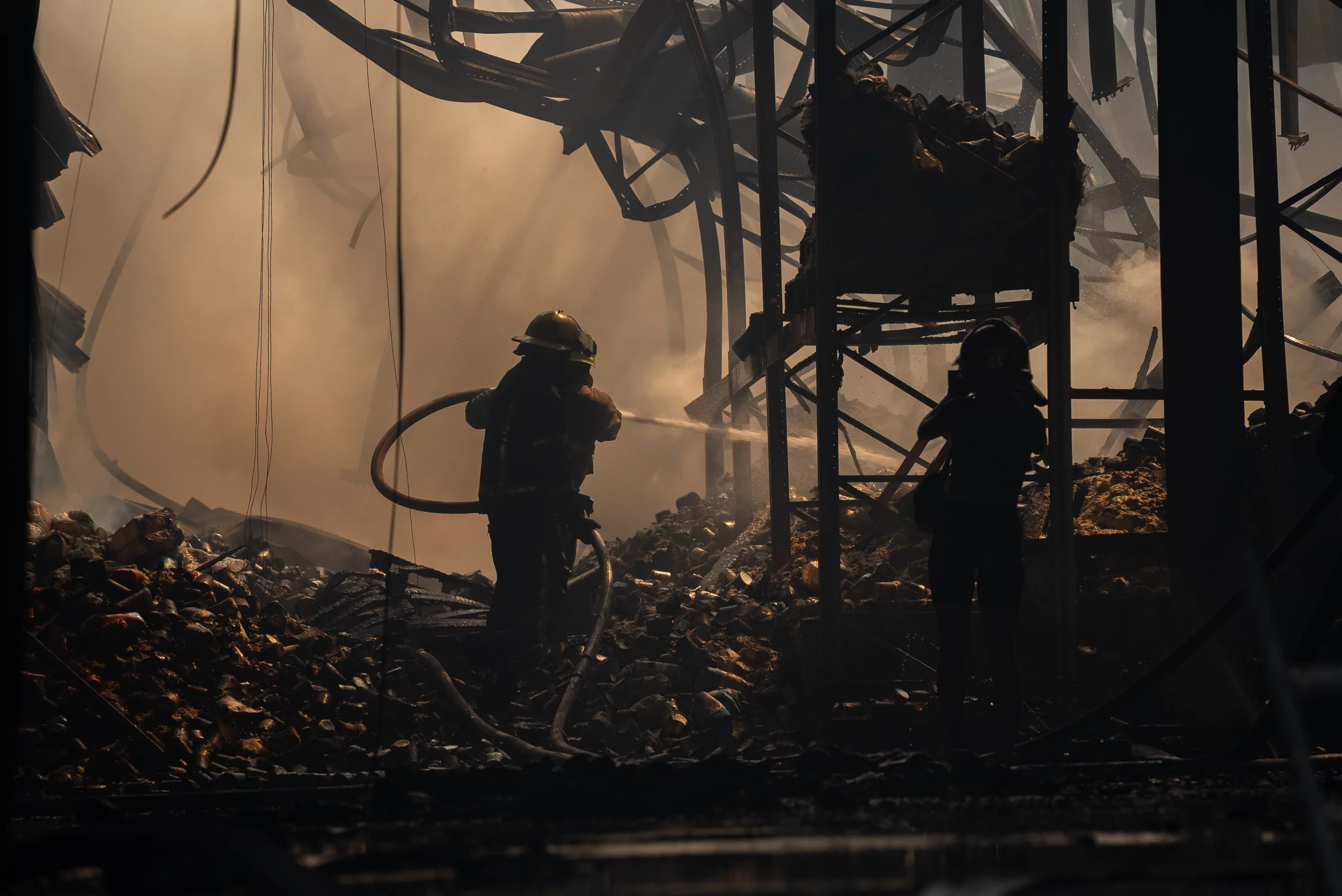 Firefighters extinguish the fire after Russian attack on Vasyshchevo village in Kharkiv outskirts on July 30