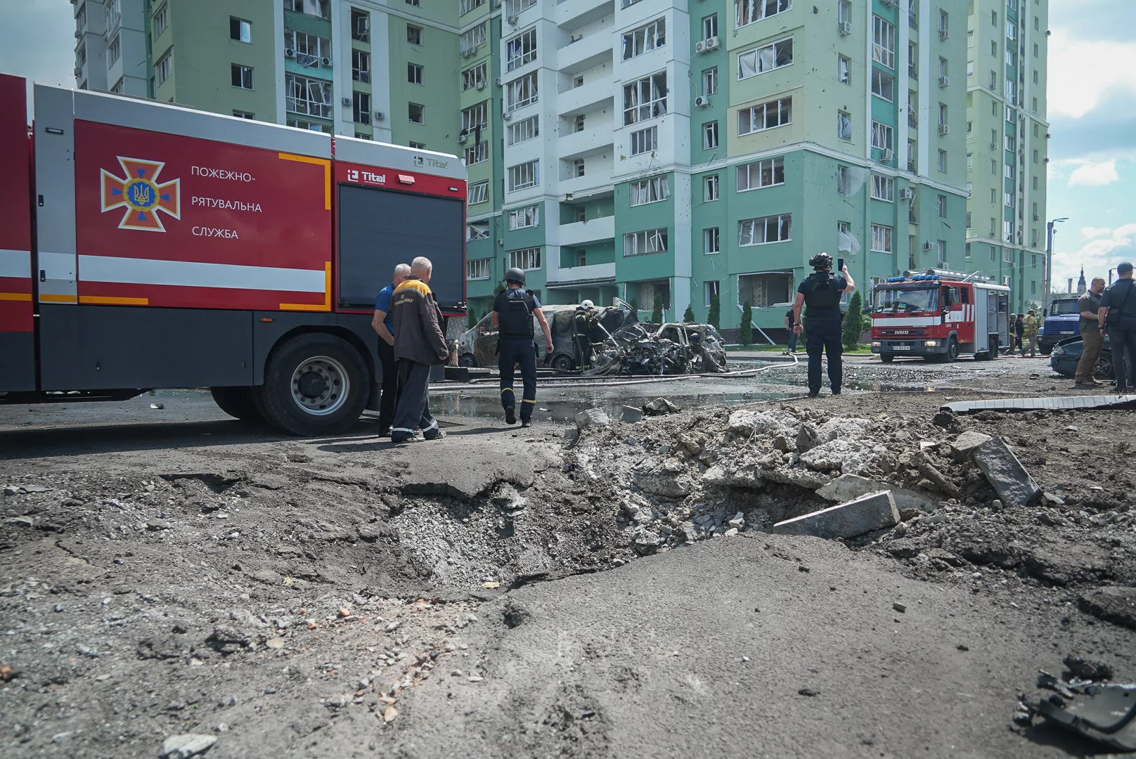 Hole in the road after Russian attack with two guided aerial bombs on the center of Kharkiv on July 24