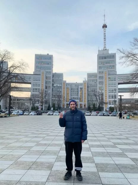 Alin Uberti in front of Derzhprom on the Svoboda Square in Kharkiv