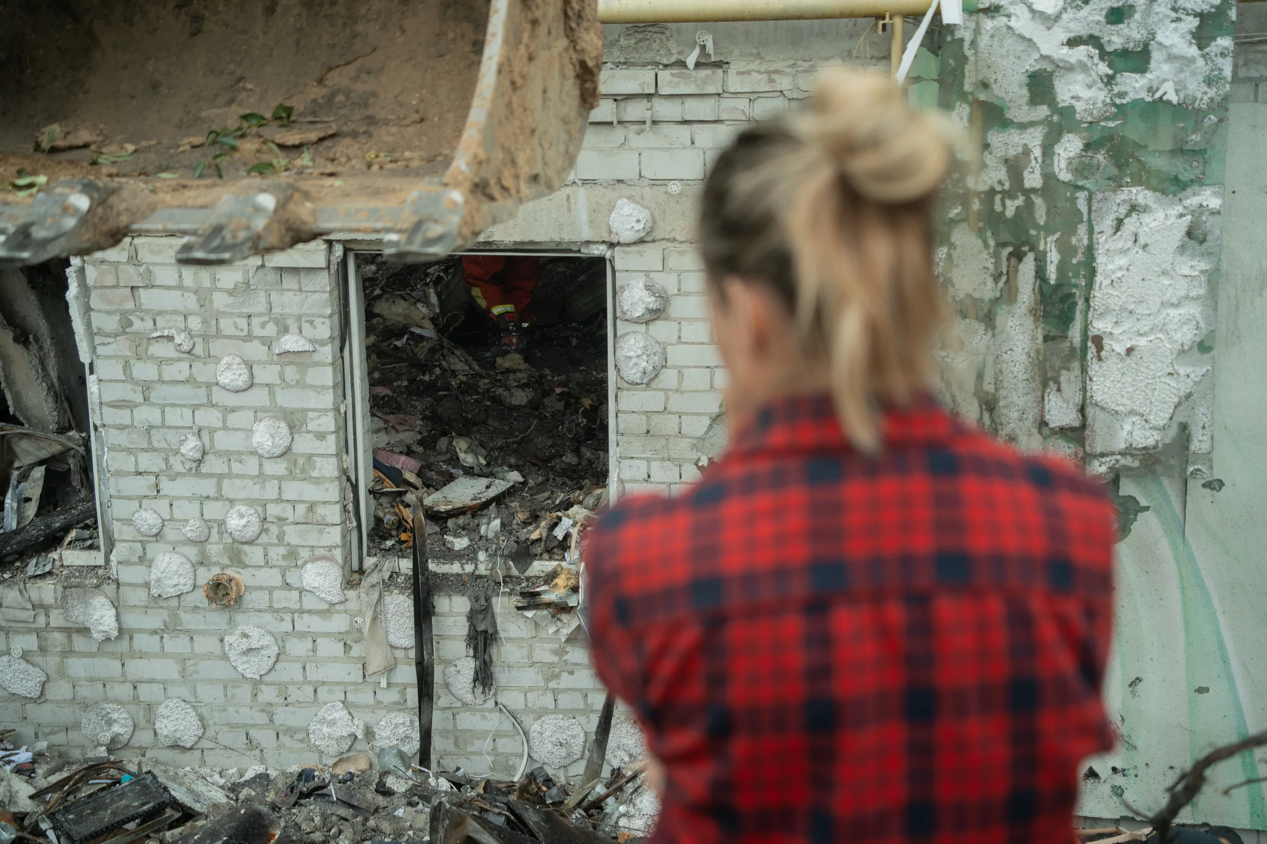 A local from the apartment building, severely damaged by a Russian drone attack on Aug. 18, 2025