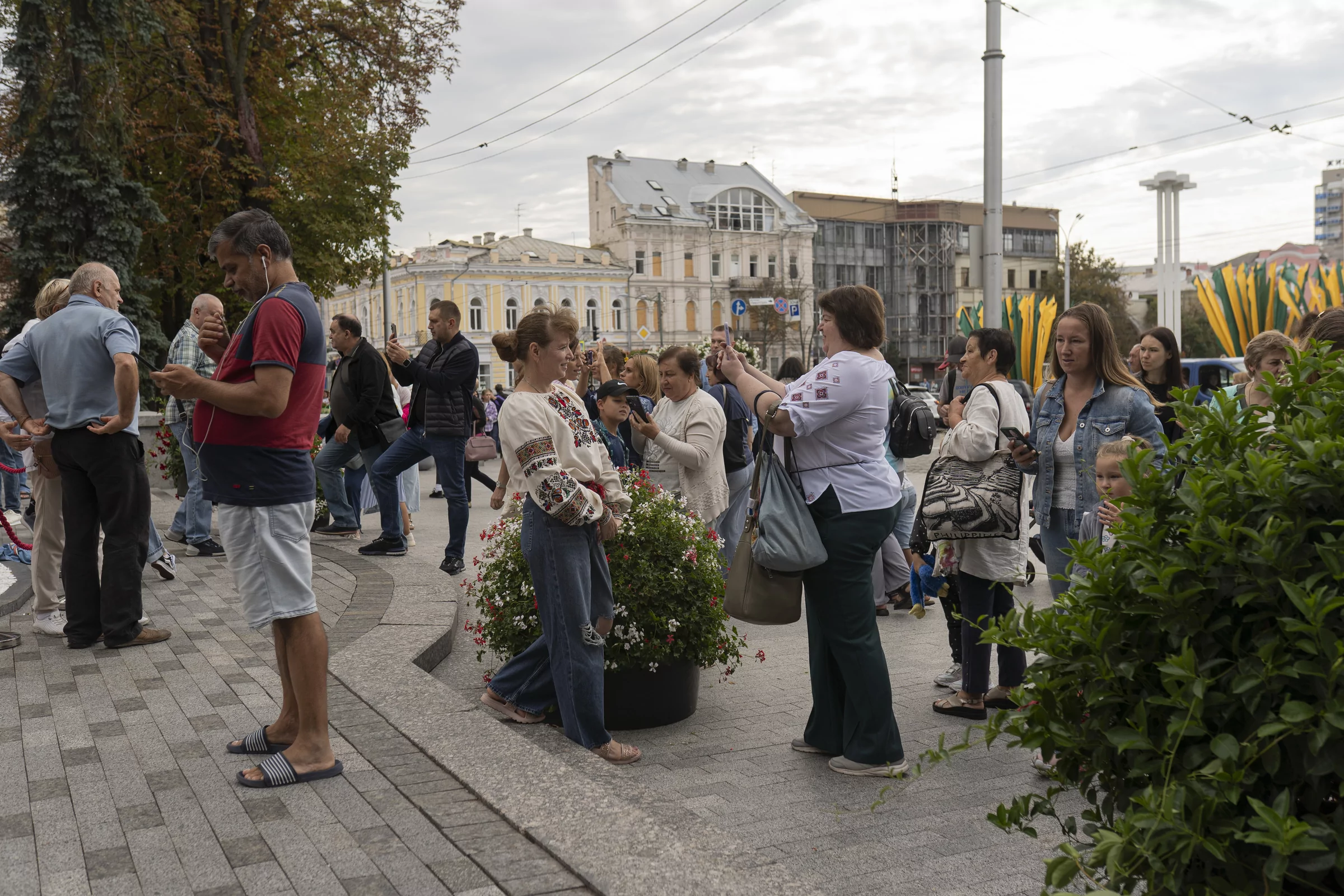 People photographing each other in the center of Kharkiv on Aug 24, 2025