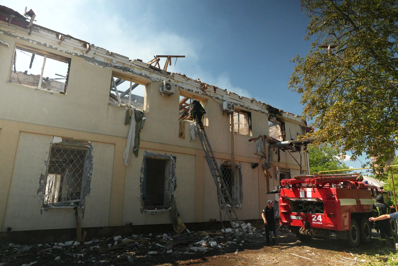 Firefighters extinguish the fire after the Russian attack on Lozova on August 5