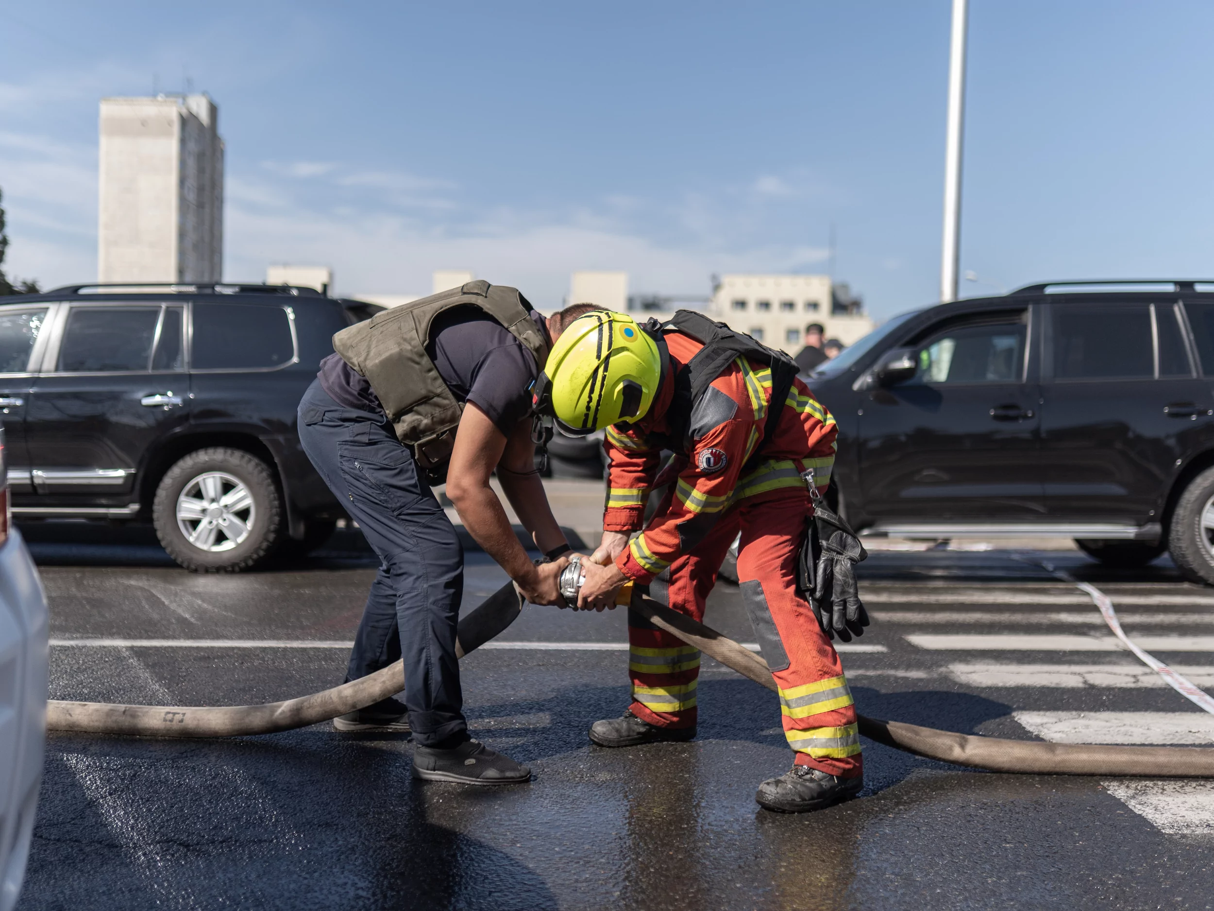 Firefighters extinguish a fire after Russian attack on Kharkiv on Sep. 16