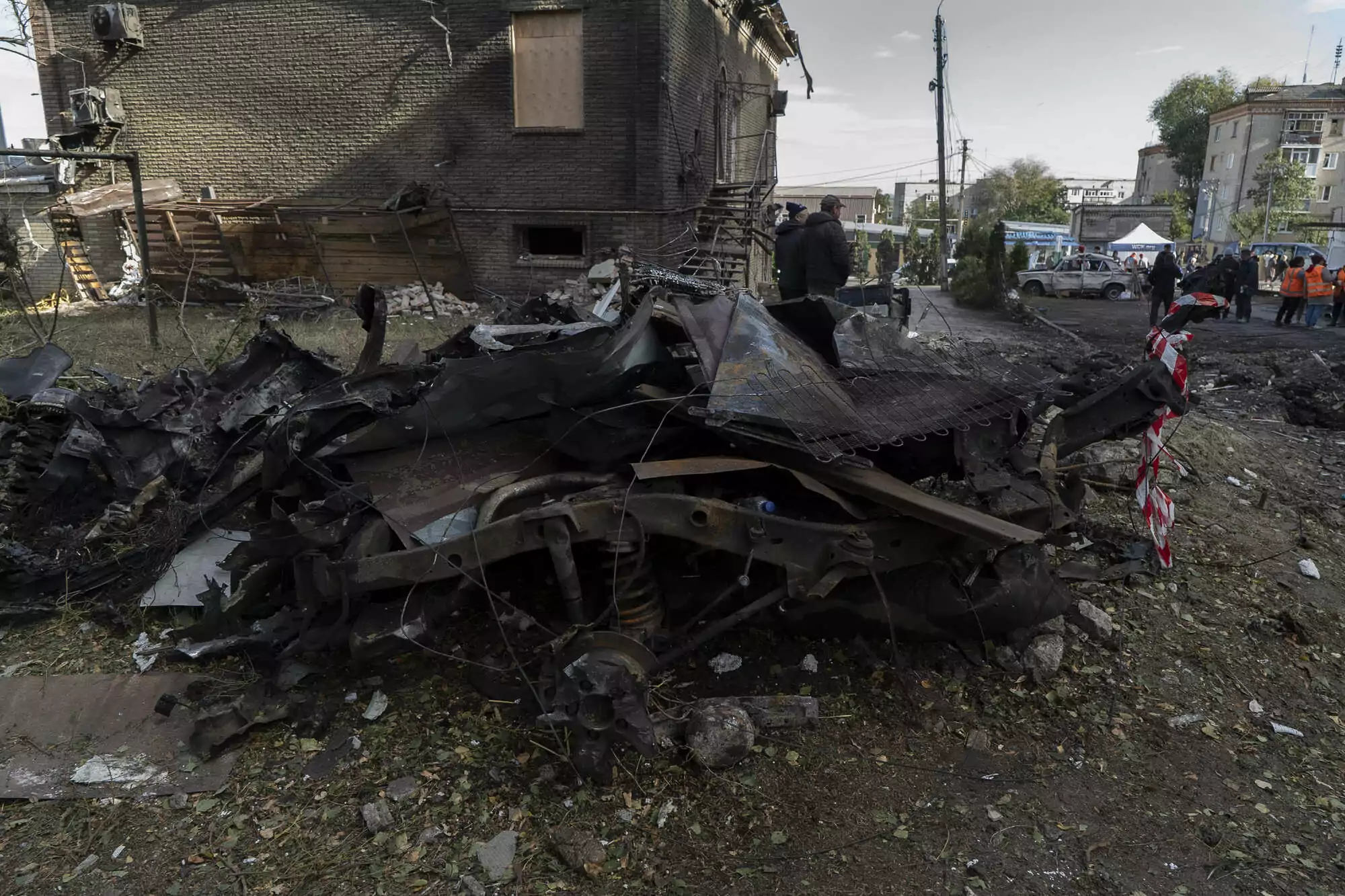 The blast wave compressed the car near the apartment building