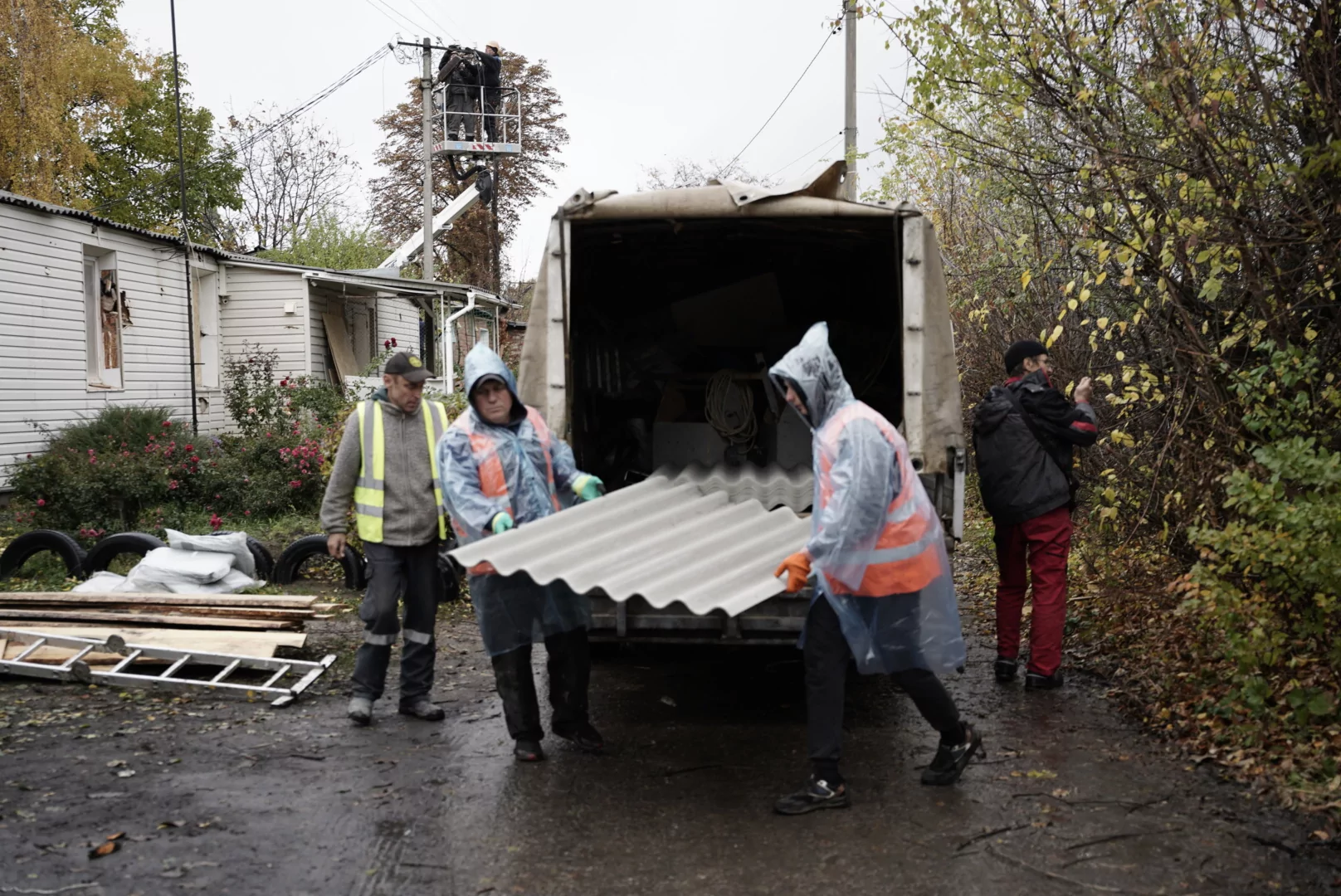 Municipal workers obtain materials to repair the damage after Russian attack on Kharkiv