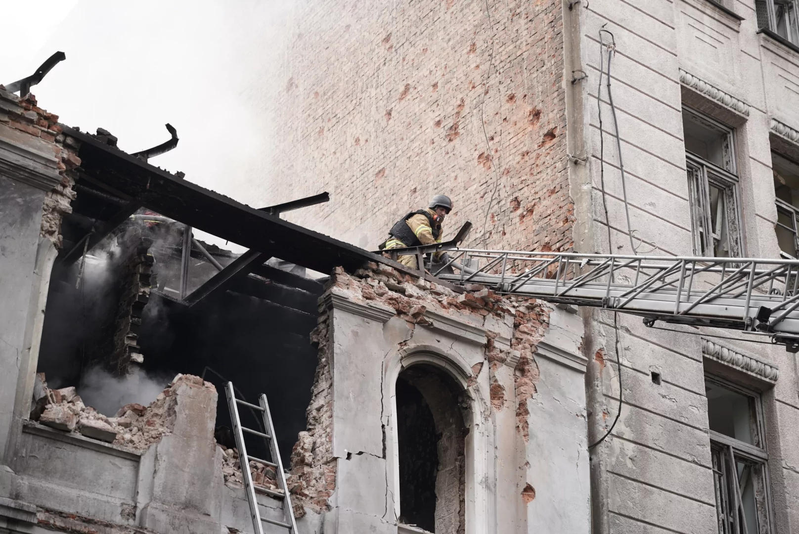 Rescuer on the roof of a destroyed building in Kharkiv