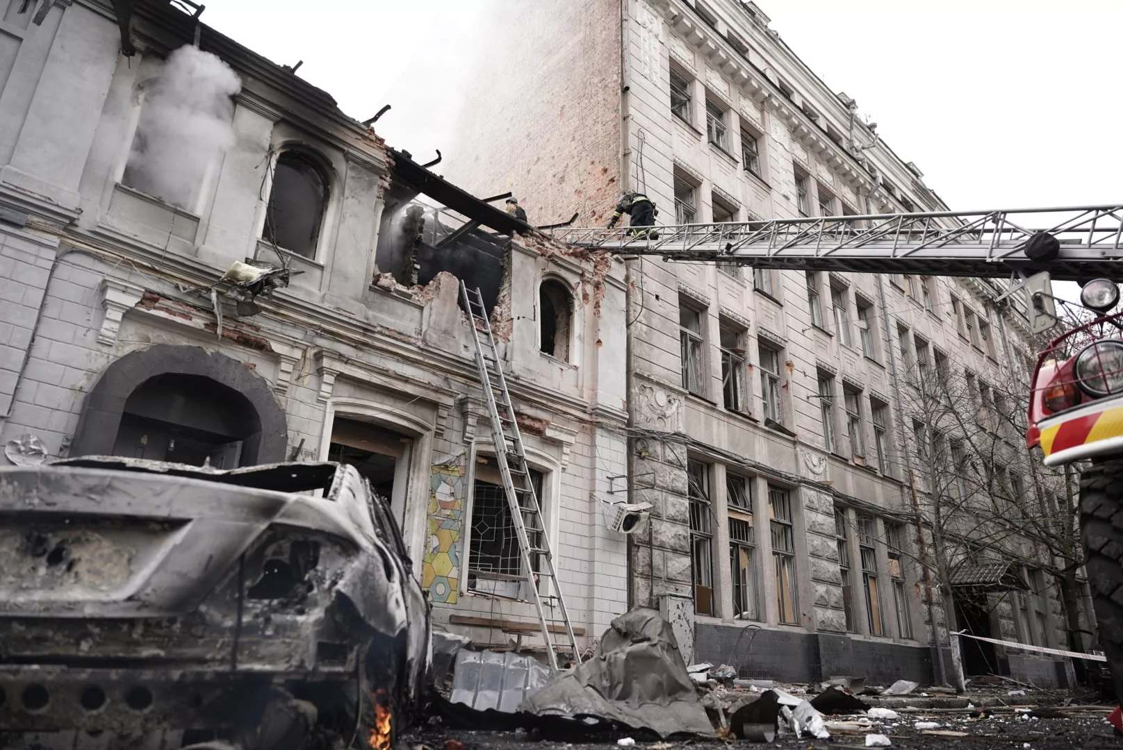 Emergency worker goes on the roof of the destroyed kindergarten