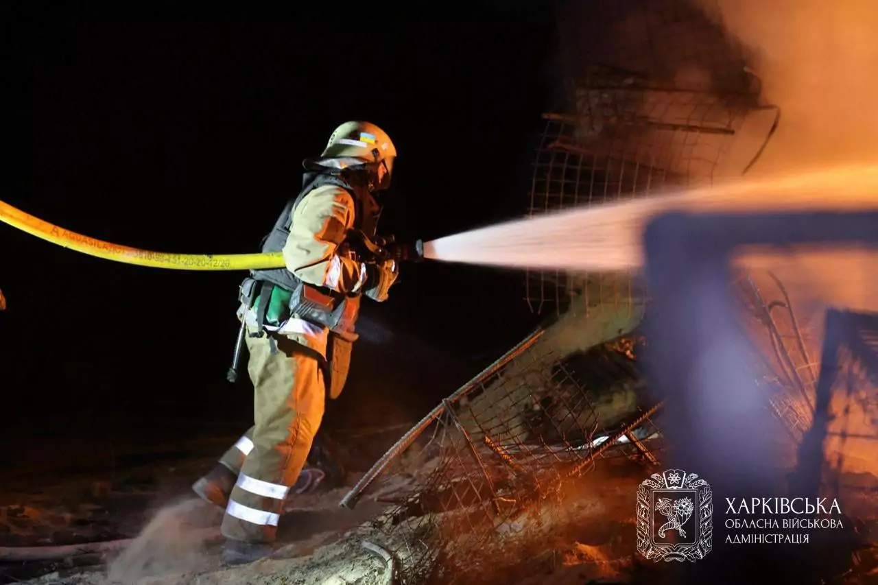 Firefighter extinguishes fire after Russian attack on Kharkiv on Oct. 5