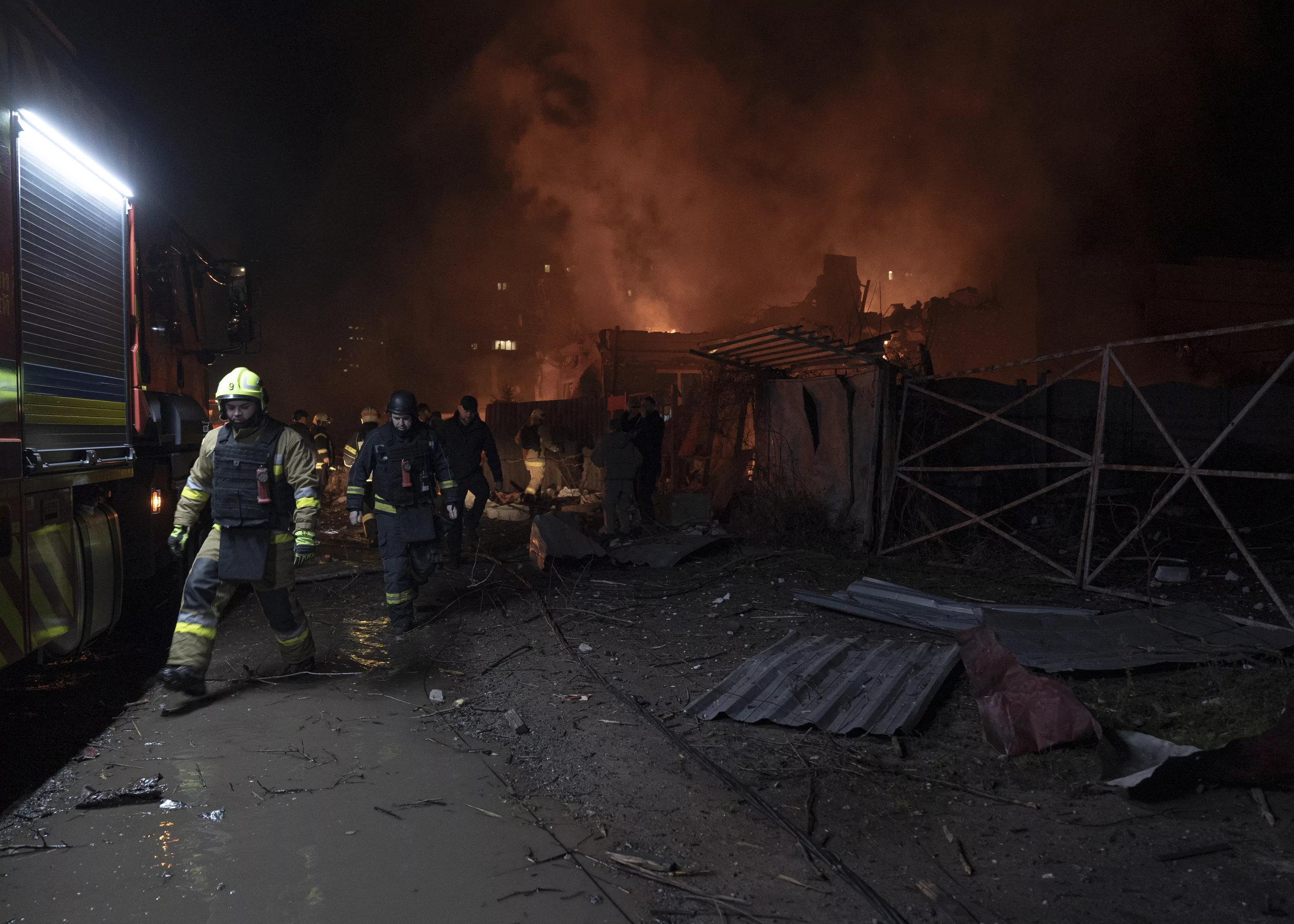 Firefighters extinguish a fire in the Shevchenkivskyi district after a Russian attack on Kharkiv