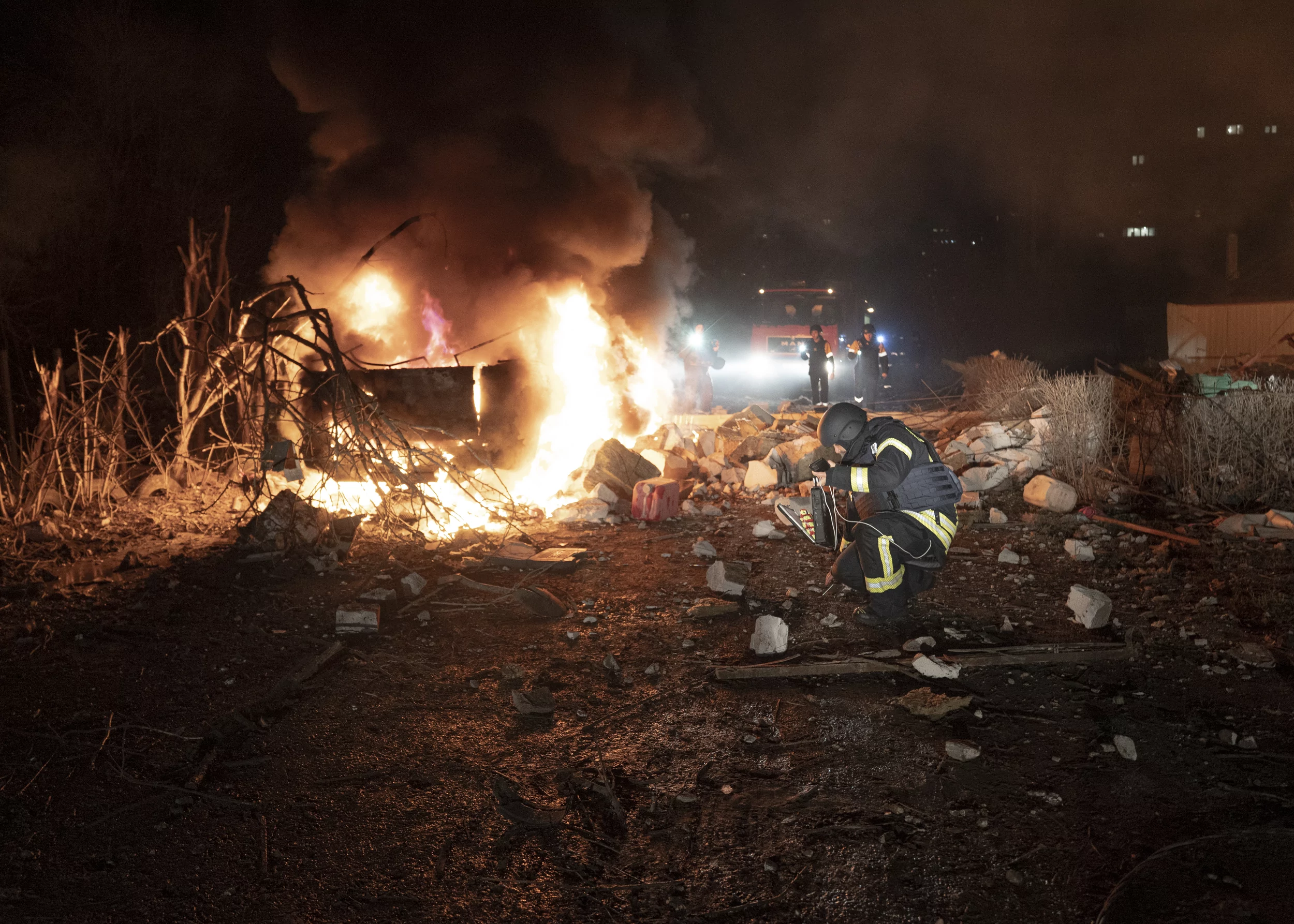 Firefighters extinguish a fire in the Shevchenkivskyi district after a Russian attack on Kharkiv