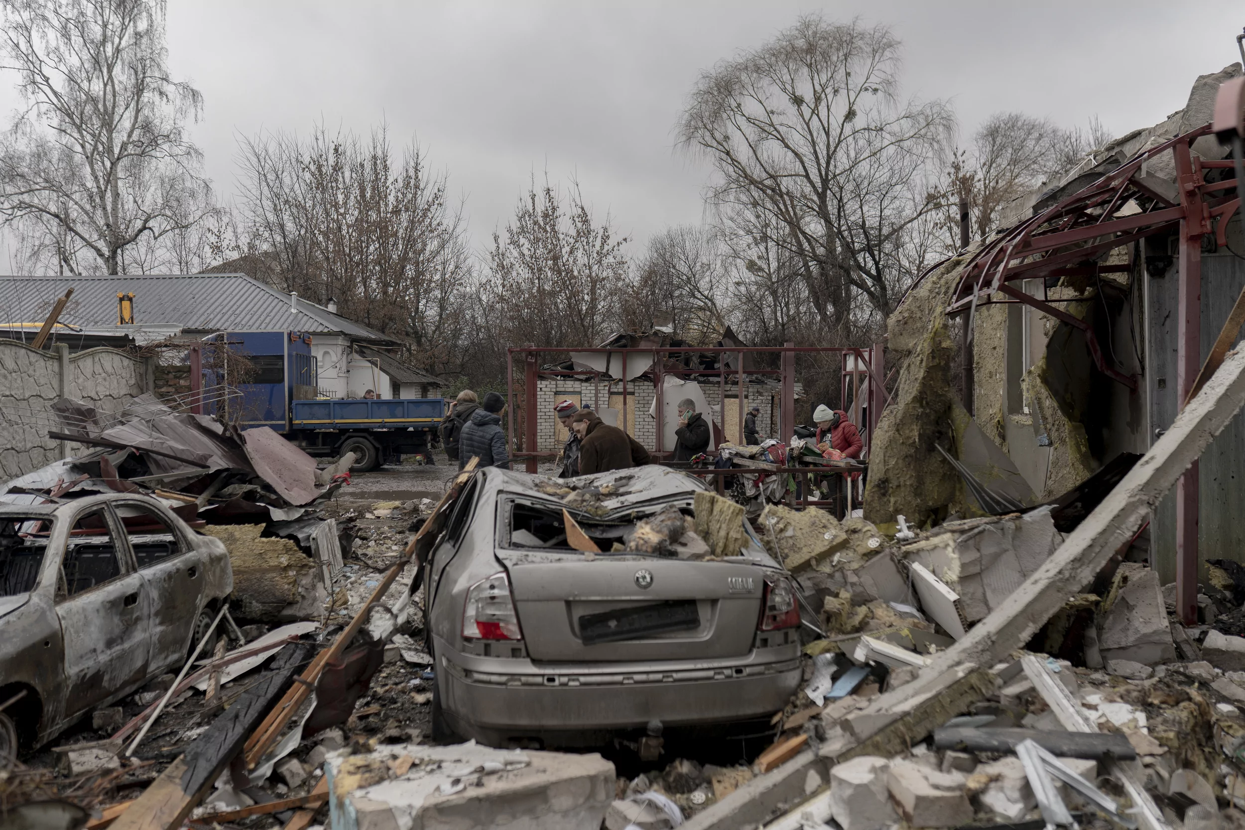 A destroyed car in a yard after a Russian attack on Kharkiv
