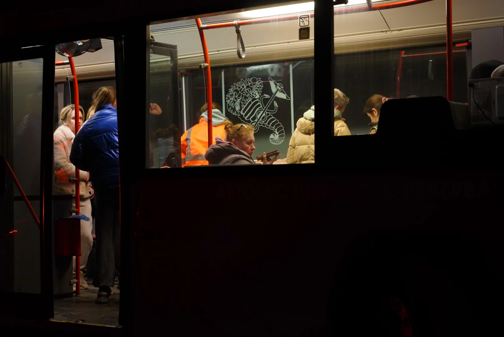 Injured civilians sit in a trolleybus after the Russian attack on Kharkiv
