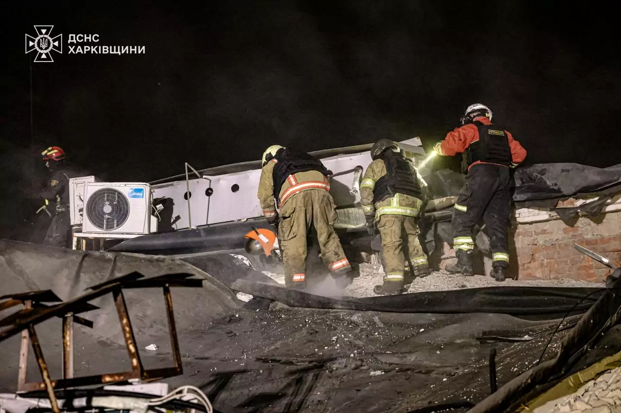 Rescuers working at the hitsite of Russian attack on Korotych