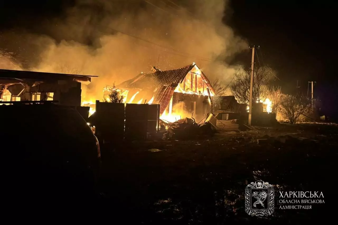 A house burns after a Russian attack on a village in the Kharkiv region