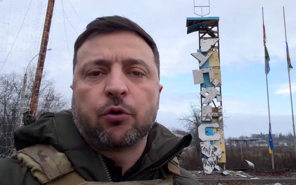 Volodymyr Zelenskyy, President of Ukraine, near the Kupiansk's entrance sign
