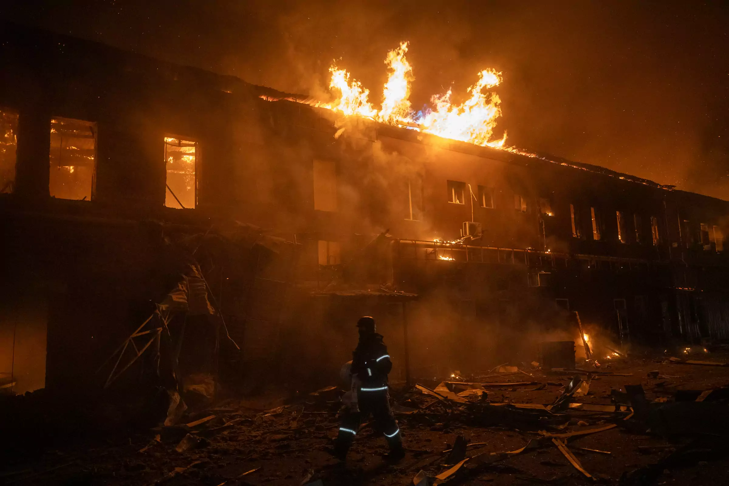 A fire started in the aftermath of a Russian drone strike on a civilian business in the Novobavarskyi district of Kharkiv. January 2025 / Photo: Gwara Media, Serhii Prokopenko&nbsp;