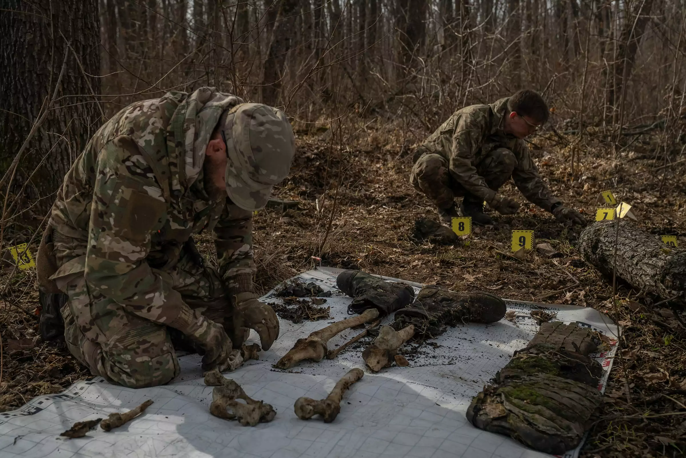 Volunteers of the &ldquo;Platsdarm&rdquo; unit gather the remains of a Russian soldier, killed during fighting at the edge of Kharkiv and Donetsk oblasts in 2022. March 2025