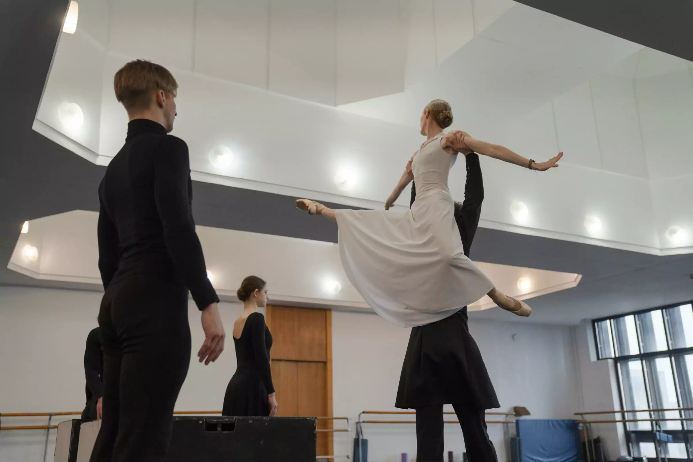Repetition of a ballet troupe of Kharkiv Theatre of Opera and Ballet before &ldquo;Christmas Gala Ballet&rdquo;. Ballet dancers in black and white suits are lined up one in front of the other, symbolizing chess. December 2025