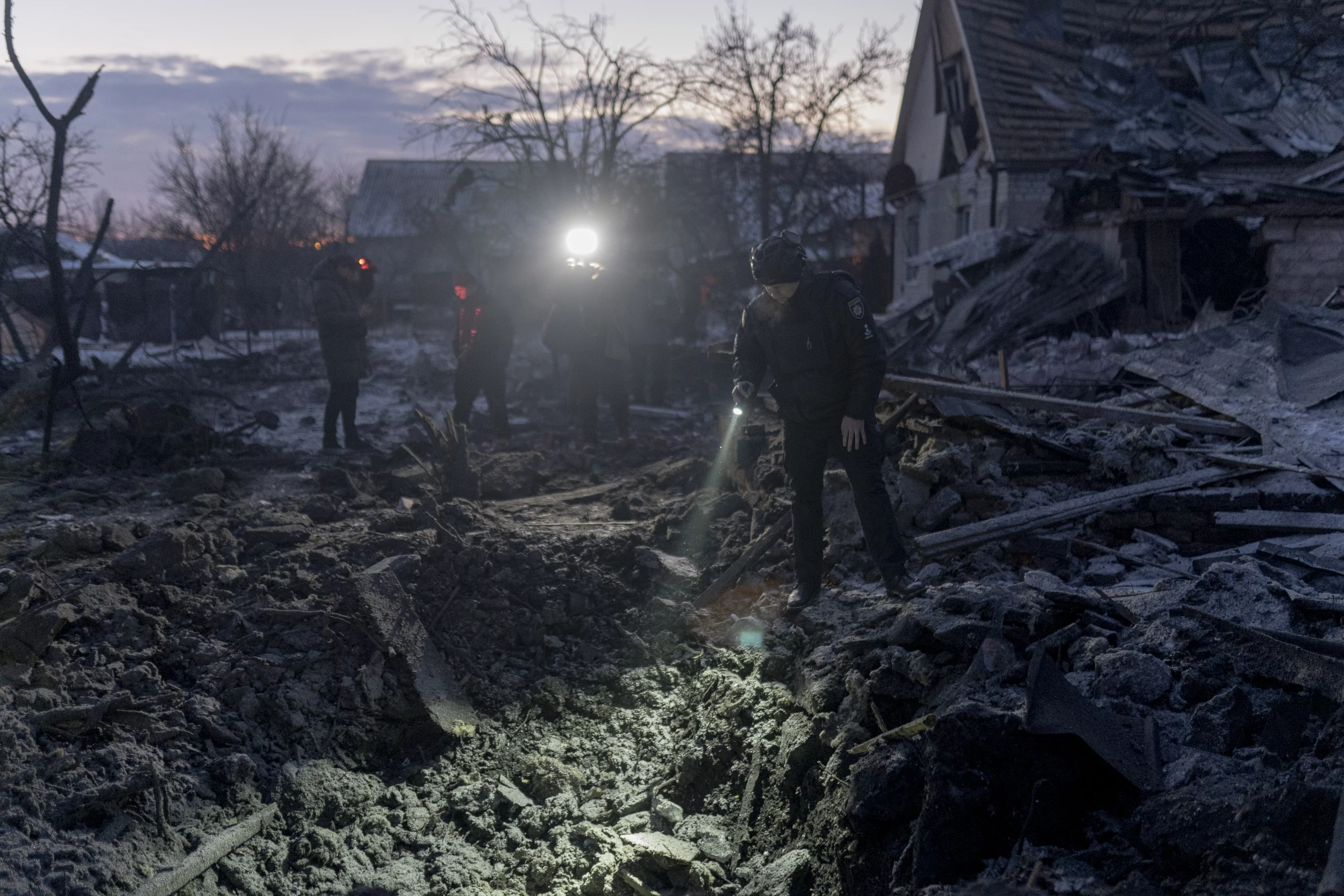 The worker of State Emergency Service at the impact site in Kharkiv