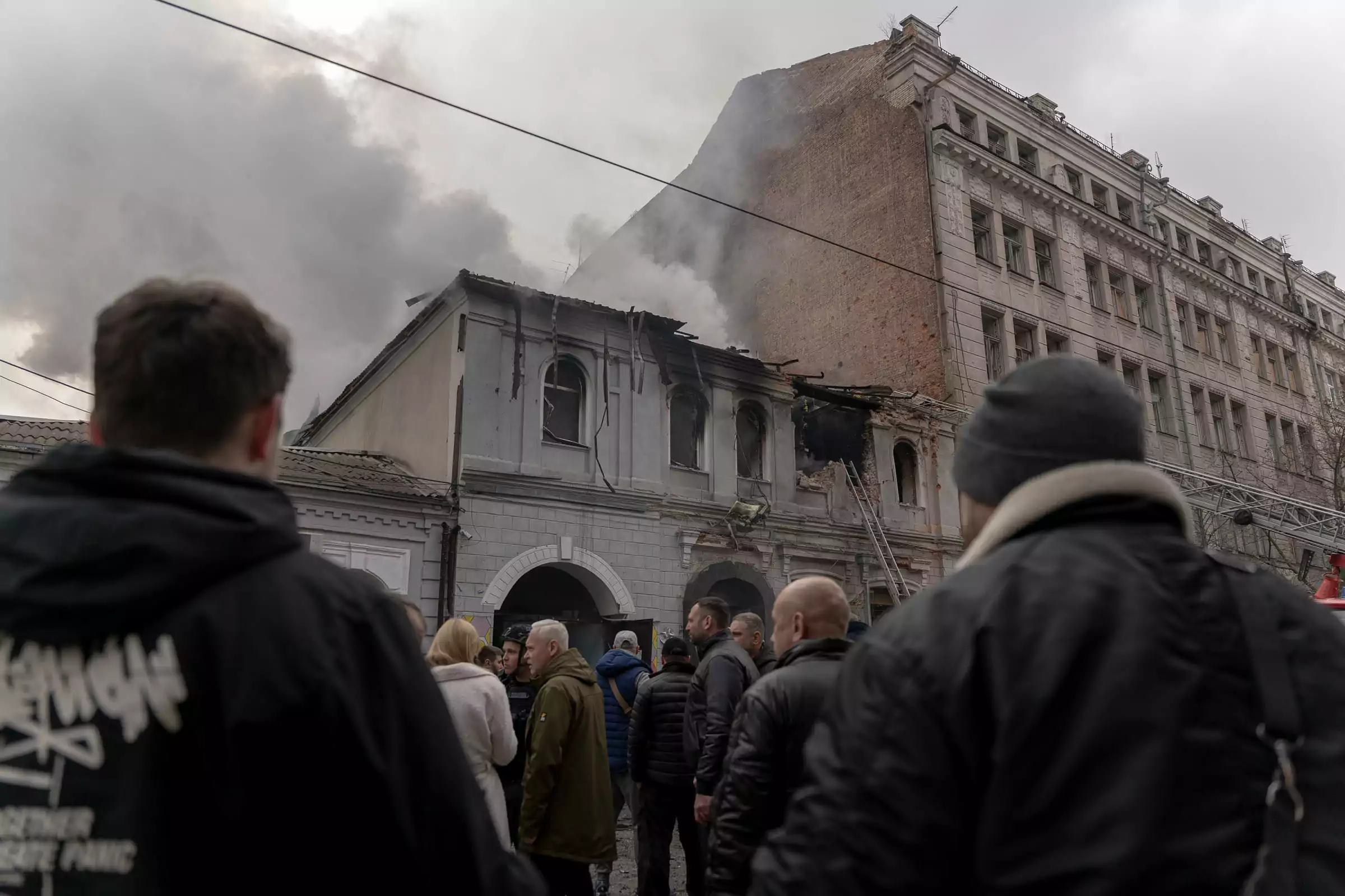People near a kindergarten that was burned in the aftermath of a Russian Shahed drone attack on Kharkiv. October 2025 / Photo: Gwara Media, Mykyta Kuznetsov&nbsp;