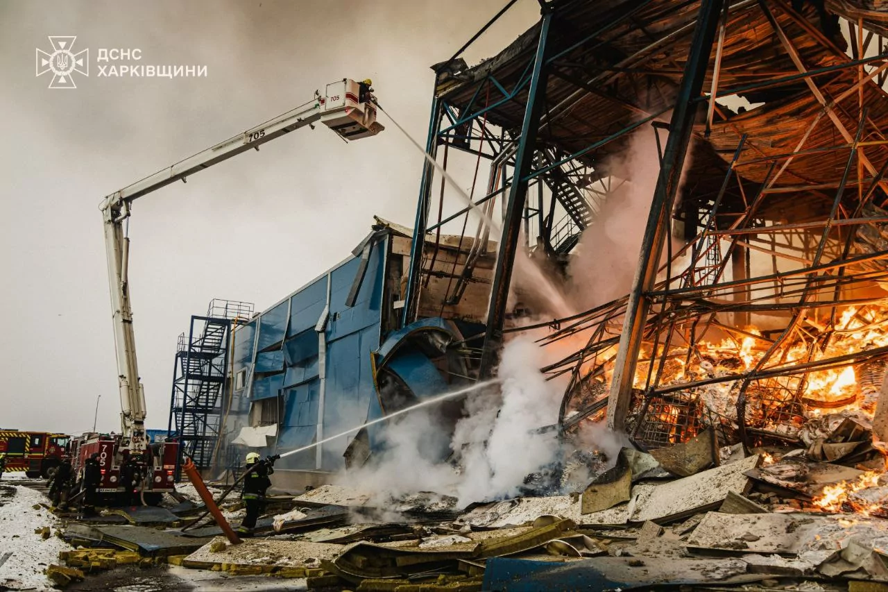Firefighters extinguish a fire on Phillip Morris building in Kharkiv oblast after Russian attack