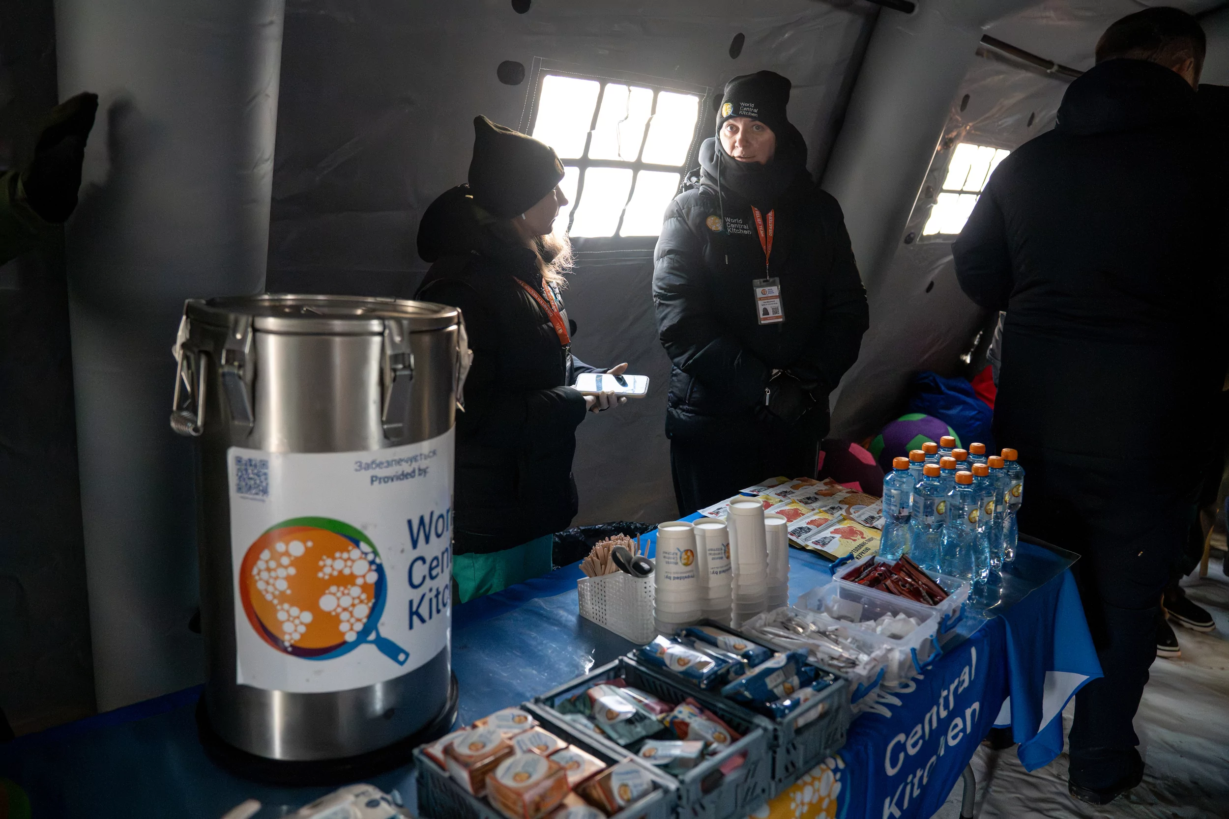 Workers at the heating points prepare hot drinks for people in Kharkiv.