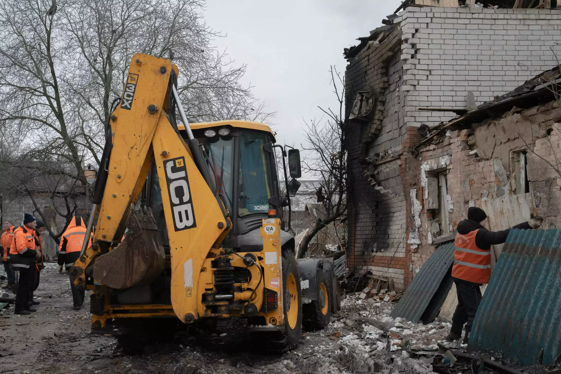 Municipal workers are clearing the rubble