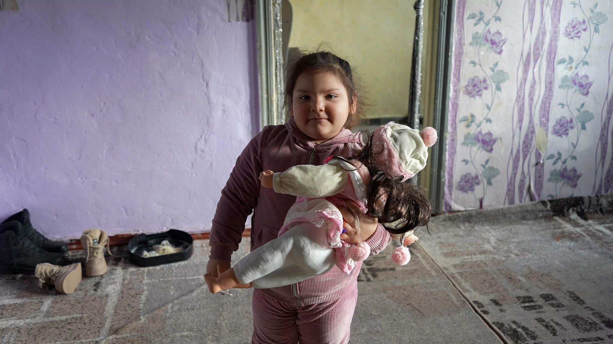 Polina is also packing her doll for the trip