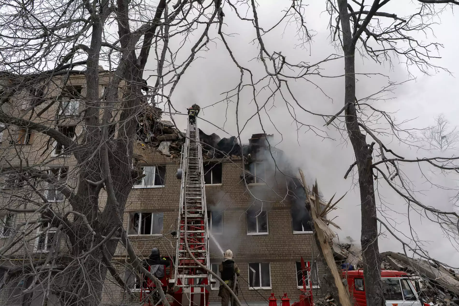 Five-story building in Kharkiv, half-destroyed and burning in the aftermath of Russian missile attack