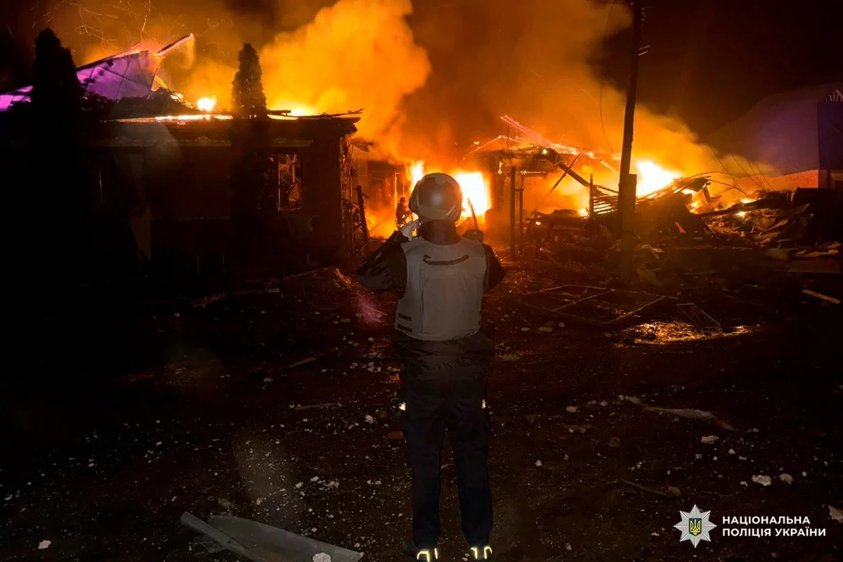 A police officer is documenting the damage after Russian attack on Kharkiv oblast