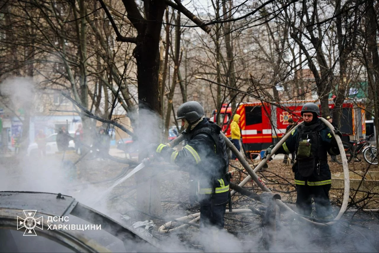 Emergency response crews putting out fire engulfing burning car in the aftermath of Russian attack on Kharkiv on Mar. 25, 2026