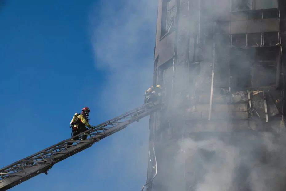 A firefighter puts out a fire after a Russian attack