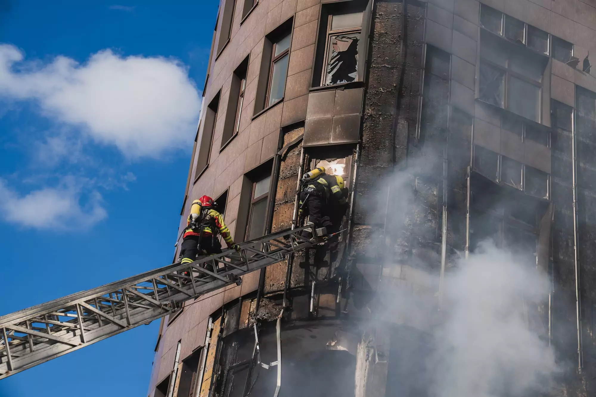 A firefighter puts out a fire after a Russian attack