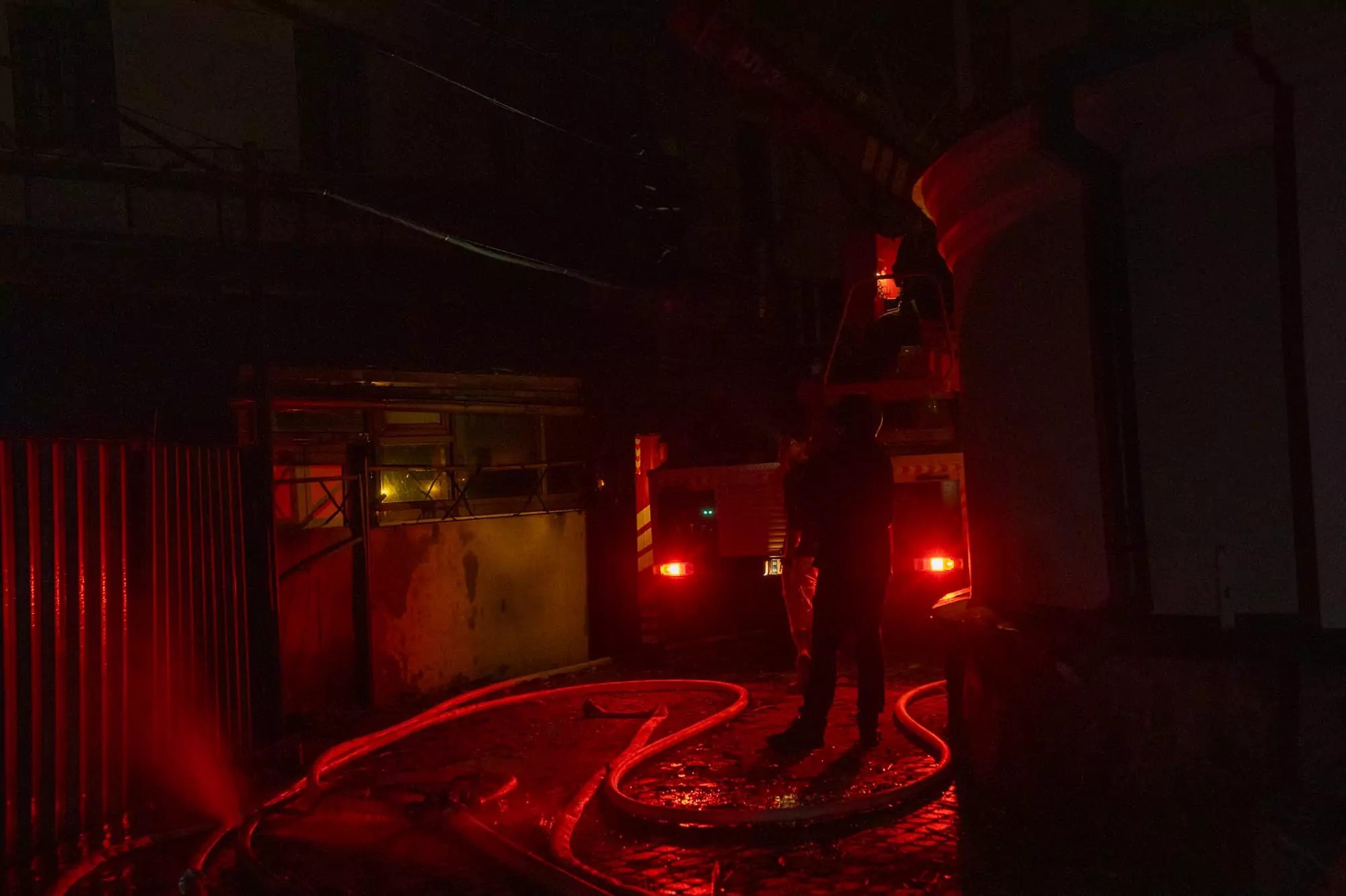 A firefighter puts out a fire after Russian attack on Kharkiv